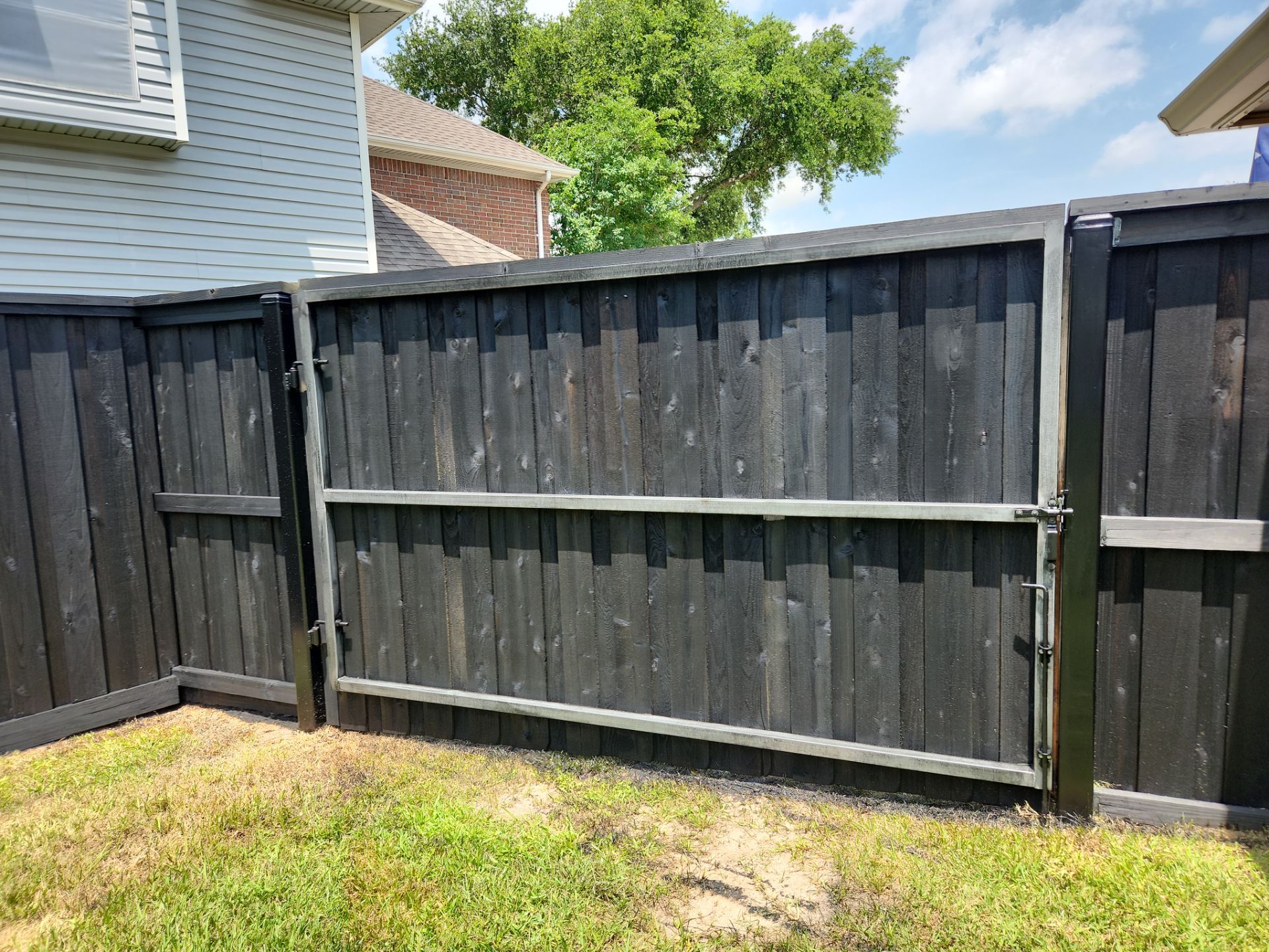 Modern Black Fence Finish by Tim's Fences