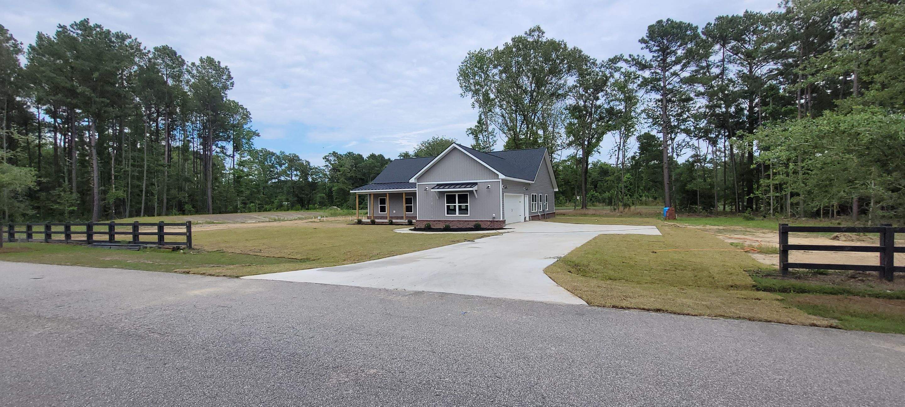 New Home Construction using brick and vertical vinyl by Cornerstone Home Builders, LLC
