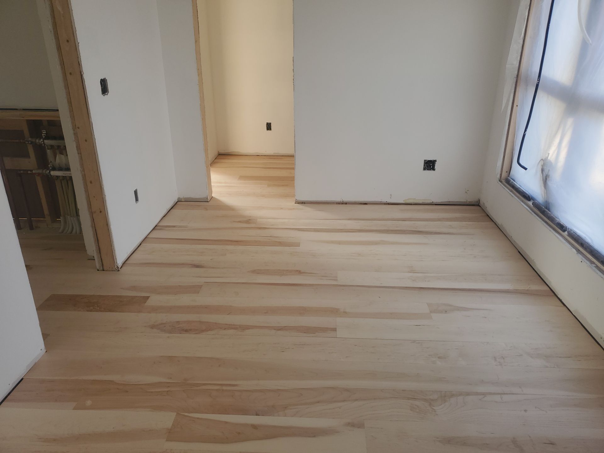 Full glue down Installation over radiant heat 7" Maple character grade by Ann Arbor Hardwoods 
