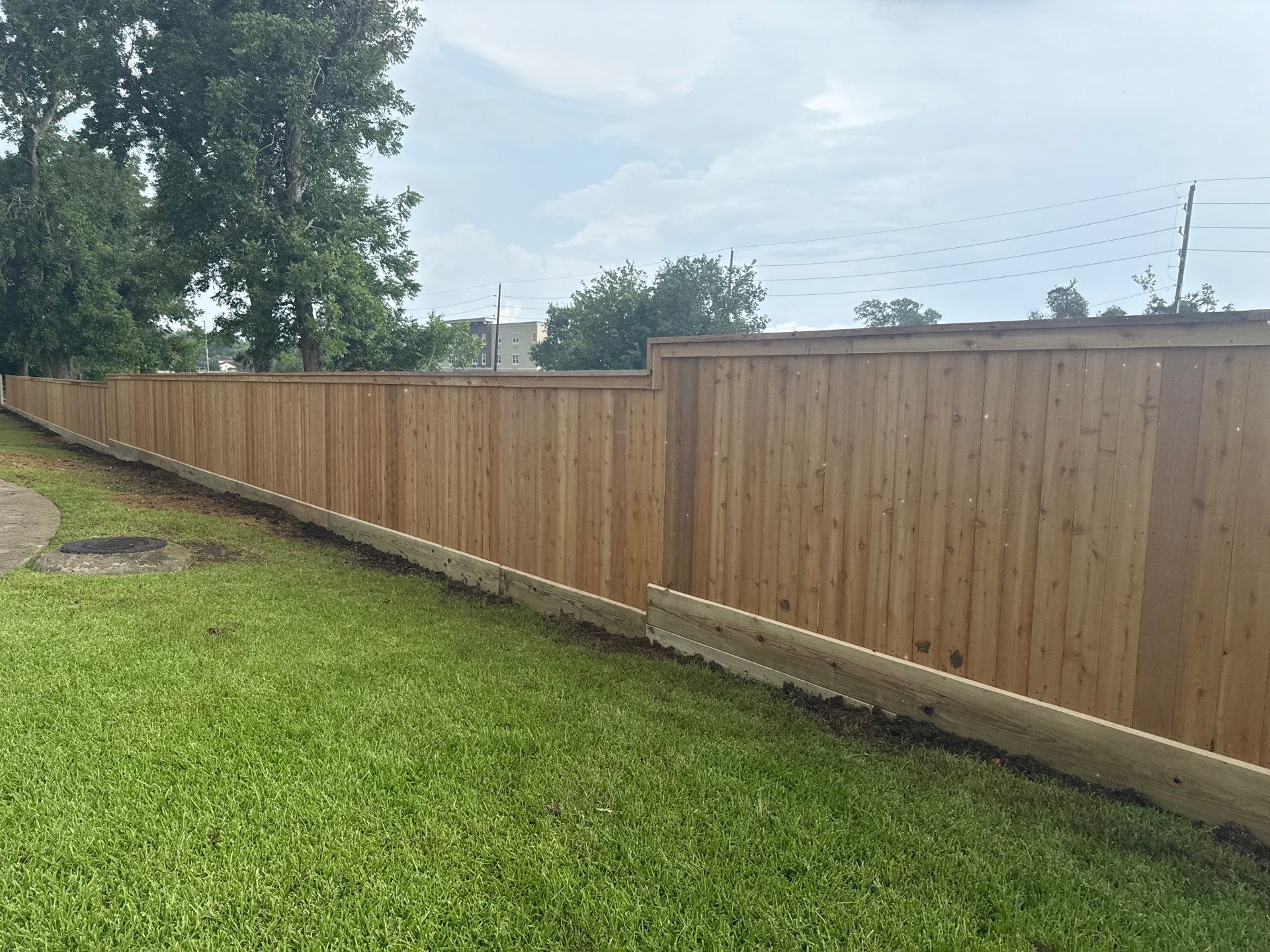 Wood Fence Installation for HOA by Tim's Fences