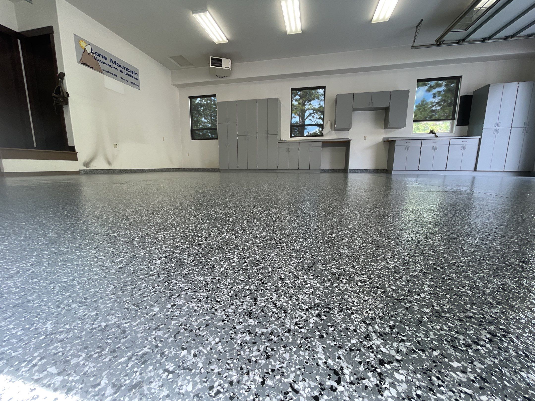 Garage Transformation using Smoke and the Penntek Evolution System by Croc Coatings, LLC
