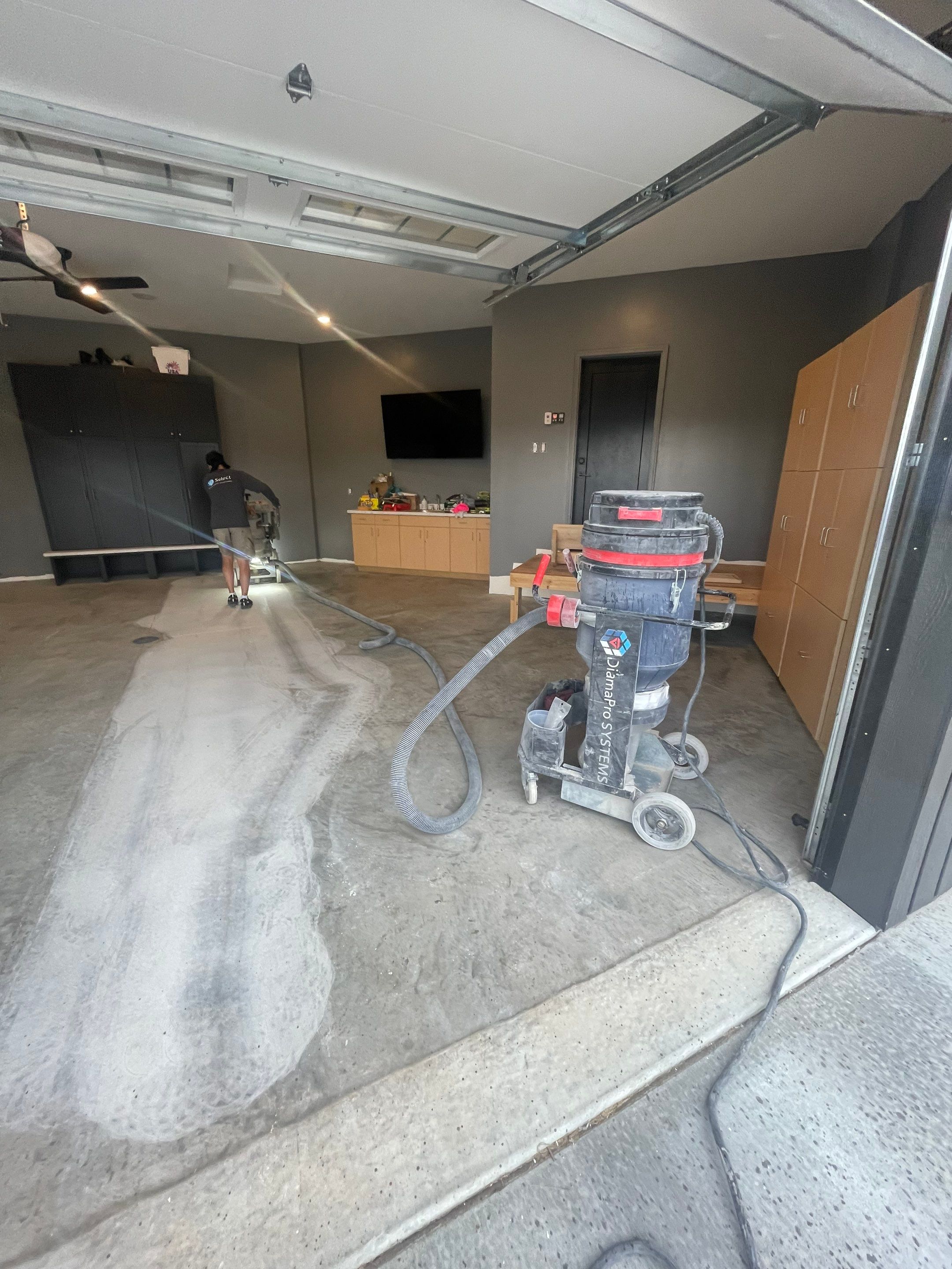 Custom Speckled Concrete Coating for Dell Rapids Garage by Select Painting, Coatings & Garage Cabinets