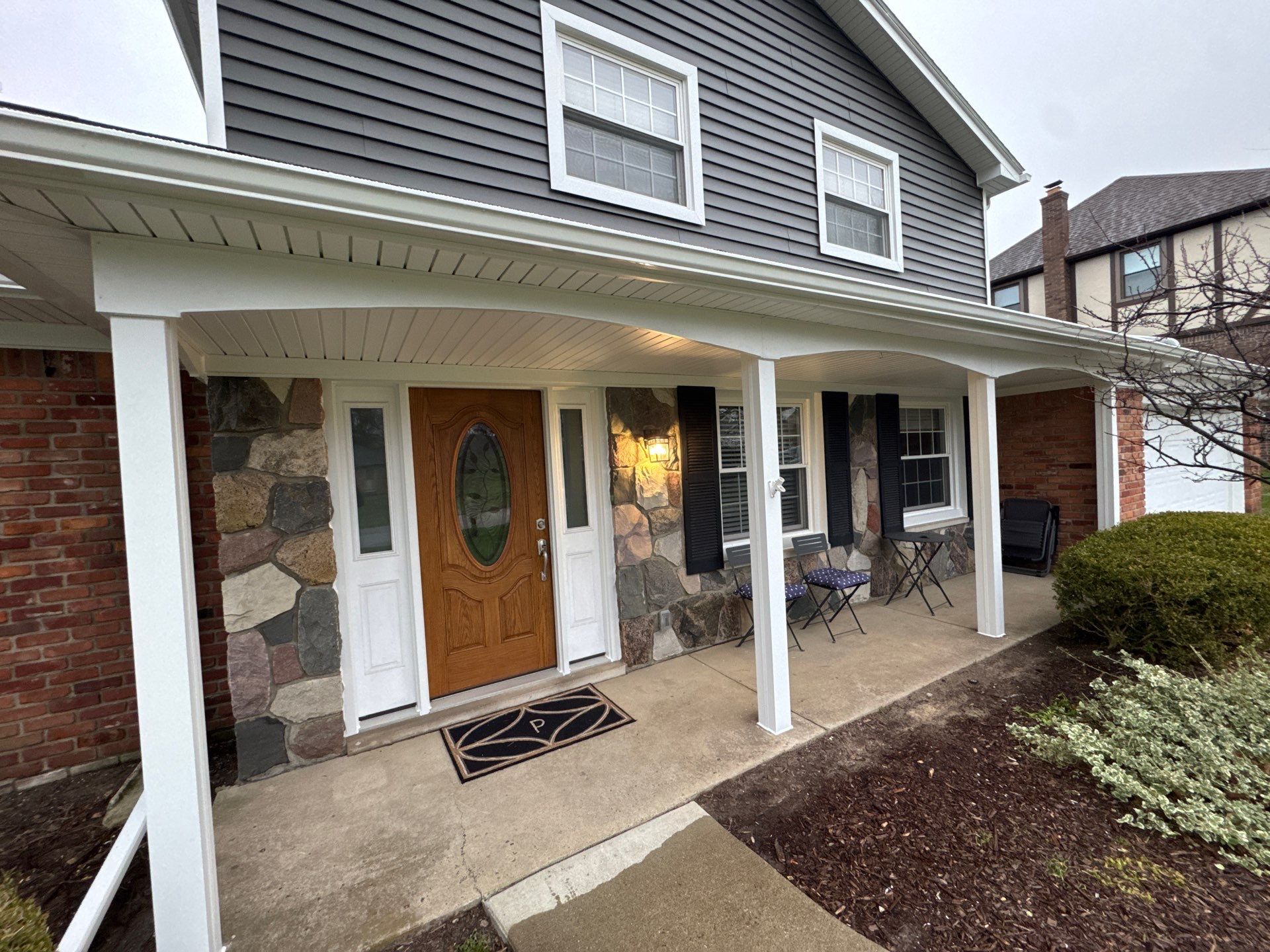 Siding Replacement using Alside Charcoal Smoke and Roof Replacement using Owens Corning Peppercorn by 180 Contractors