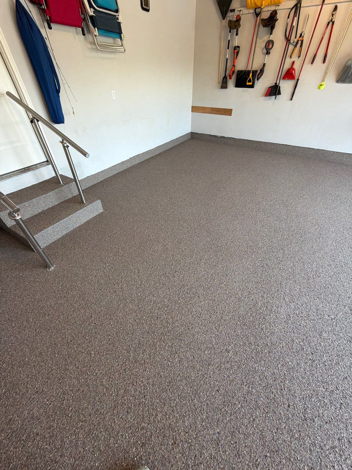 Garnet Polyaspartic Flake Garage Floor Installation in Zeeland by Gordon Painting