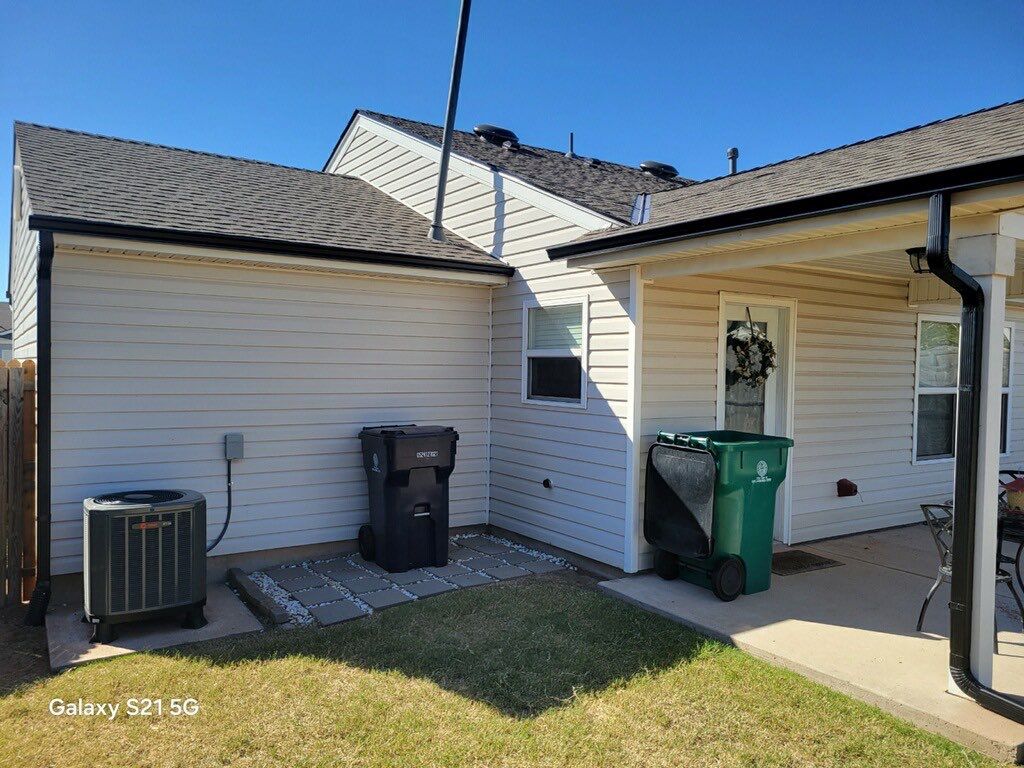 Roof Replacement and Gutter Installation in Edmond, OK by McCann's Roofing and Construction