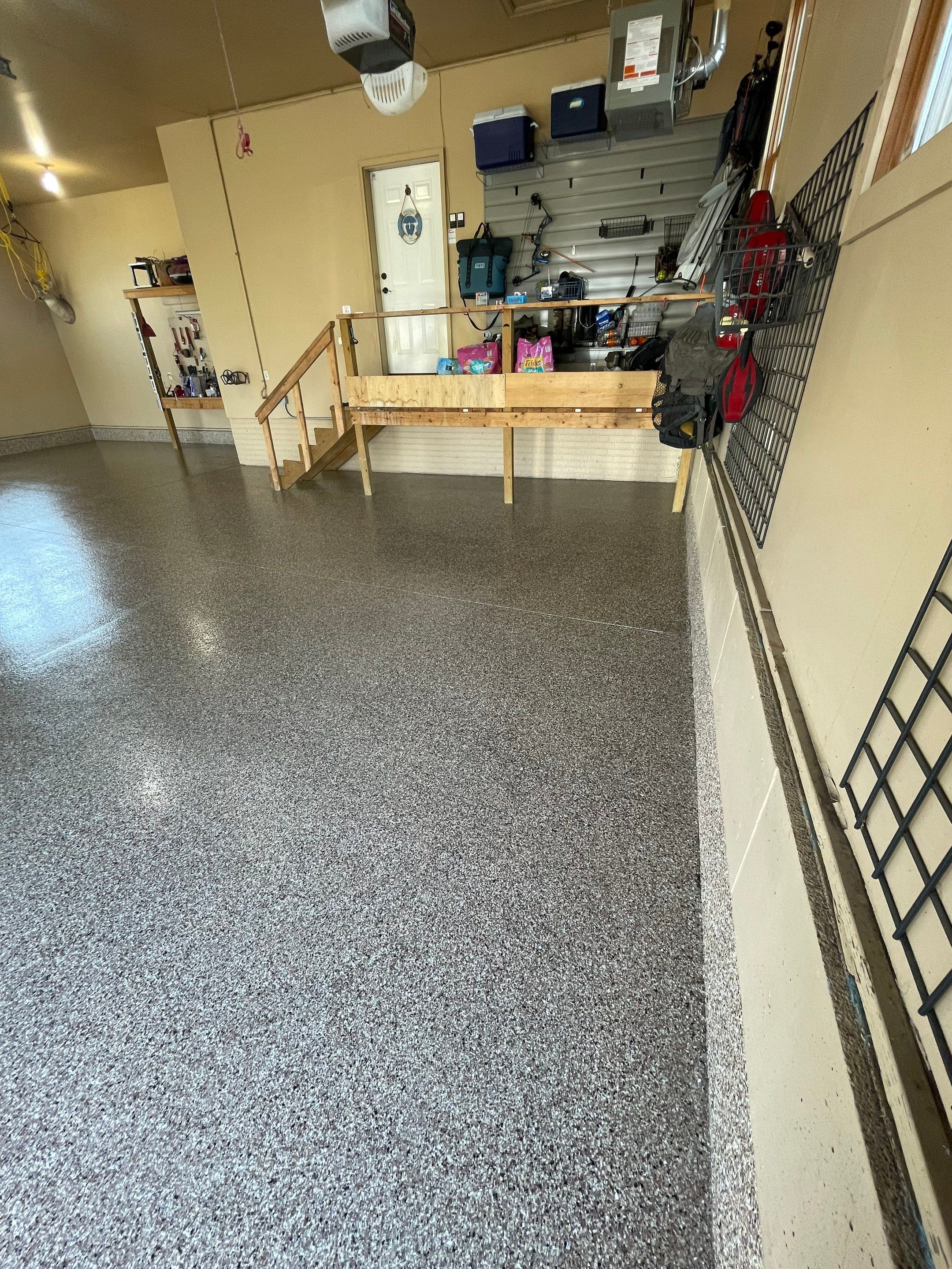 Residential Garage Floor Transformation with Speckled Epoxy Coating by Select Painting, Coatings & Garage Cabinets
