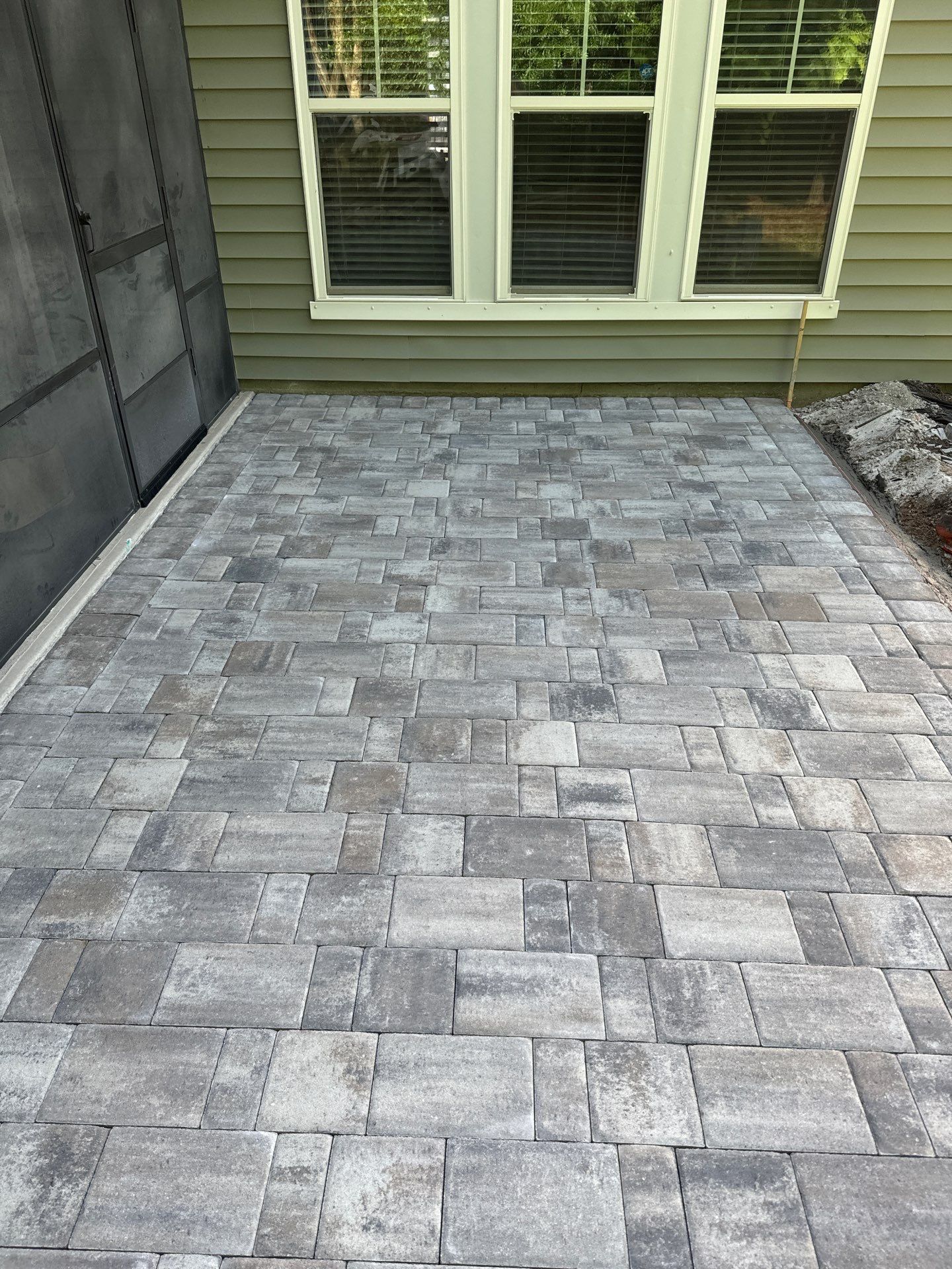 Custom Paver Patio Extension and Circular Fire Pit in Bluffton by Lowcountry Scapes, LLC