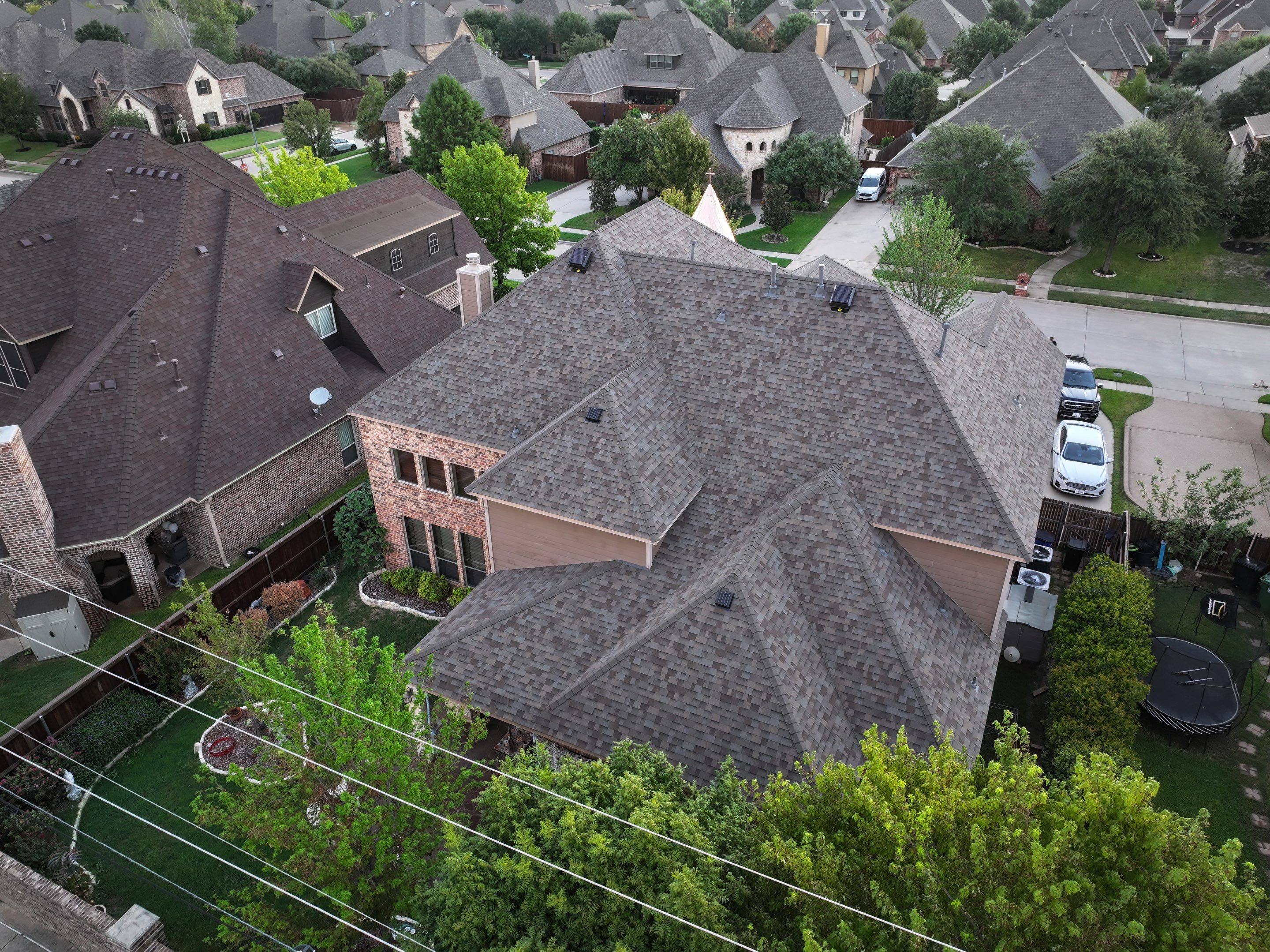 Installing Custom copper turret and Malarkey Vista Class 4 shingles Hail Damage Upgrade by Becker Roofing and Exteriors