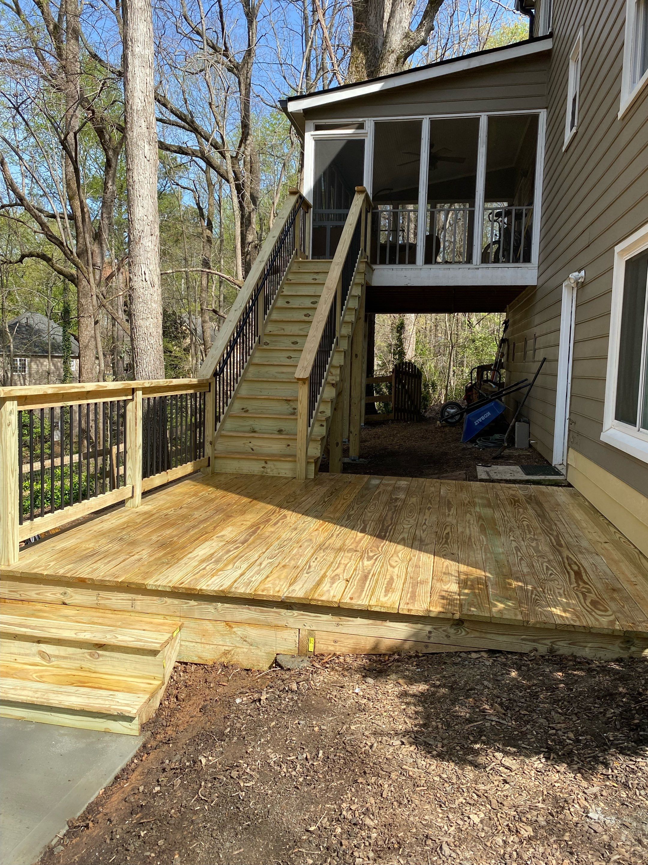 Pressure-Treated Wood Deck and Staircase Installation in Kennesaw by Swift Home Renovations 