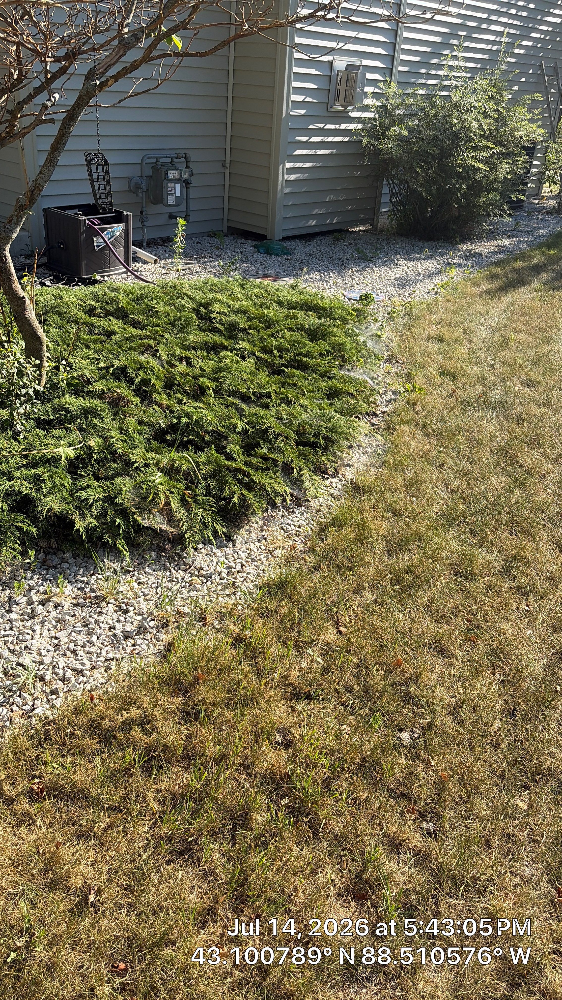 Decorative Stone and River Rock Landscaping for Oconomowoc Residence by CompanyCam Sales Demo