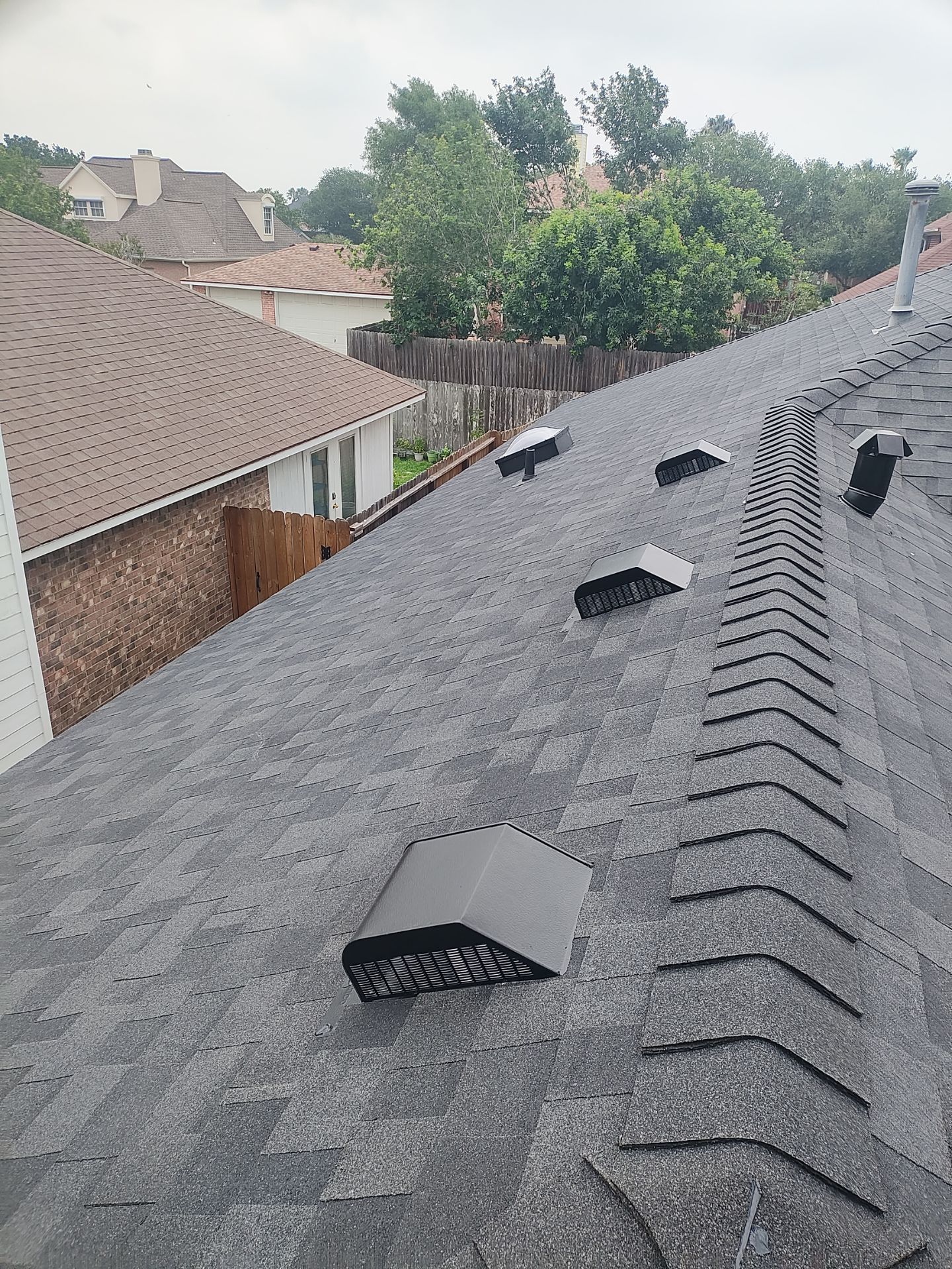 Nothing looks nicer than a little black roof by Bayfront Roofing and Construction