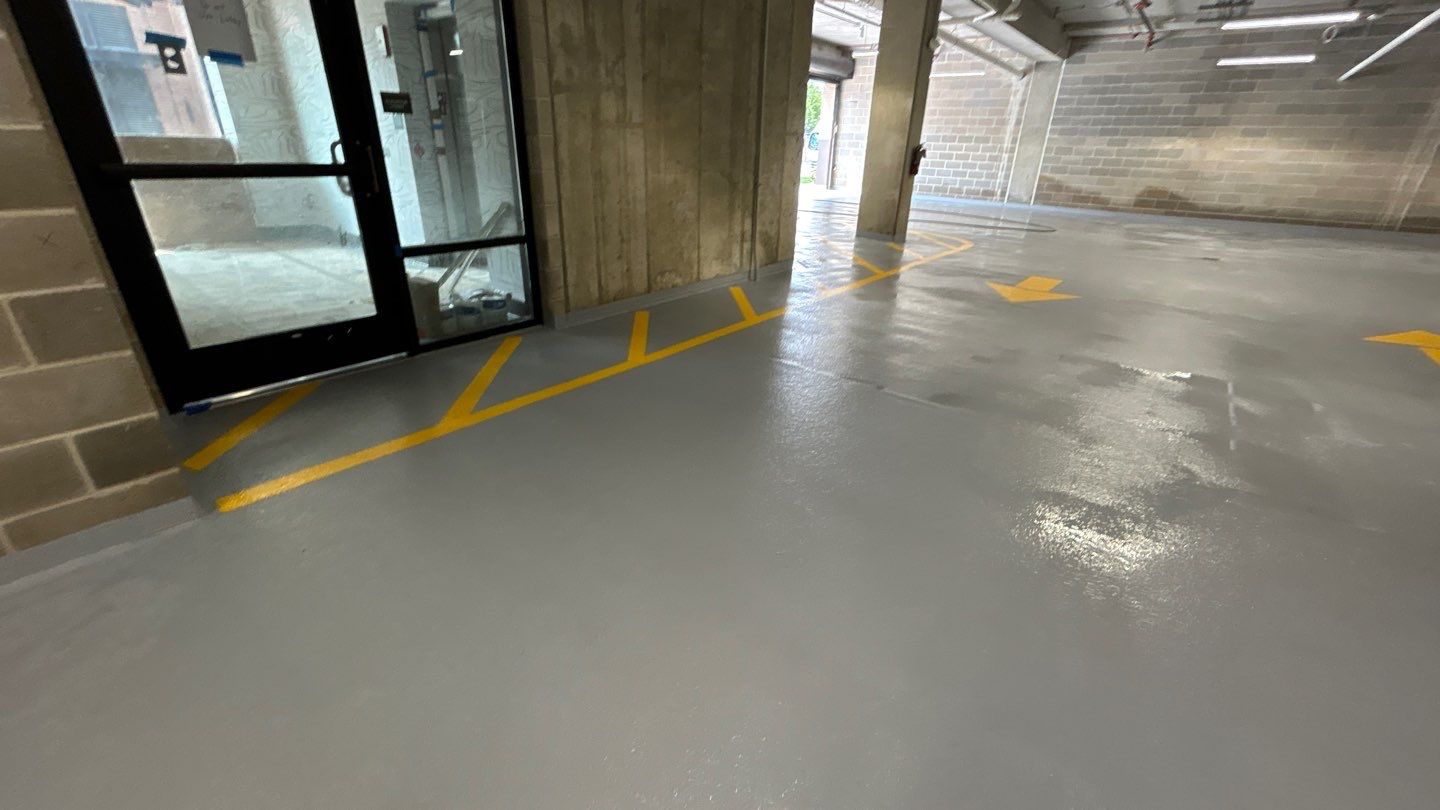 Parking garage using Hot water by Northern Power Washing LLC.