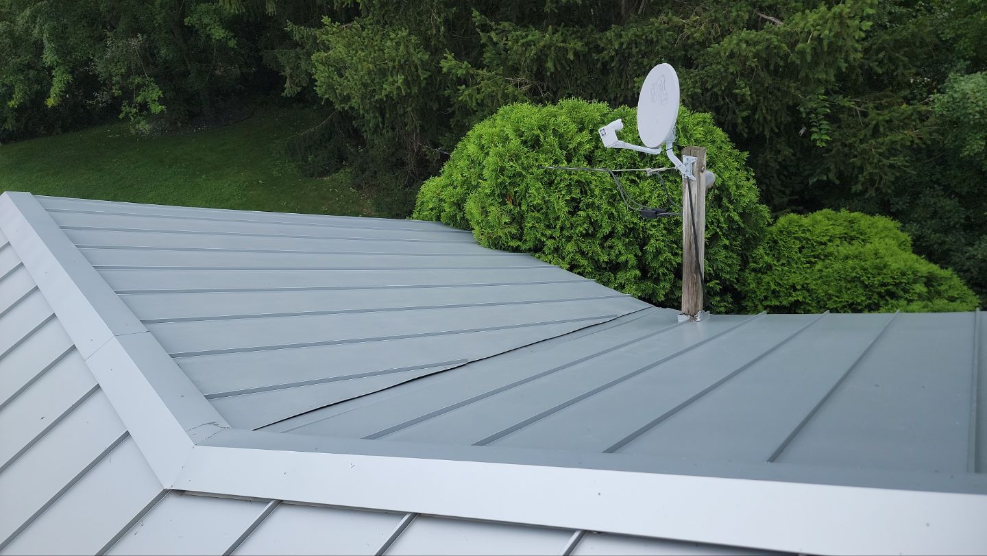 roof washing using Algaecide, soft wash soap by Northern Power Washing LLC.