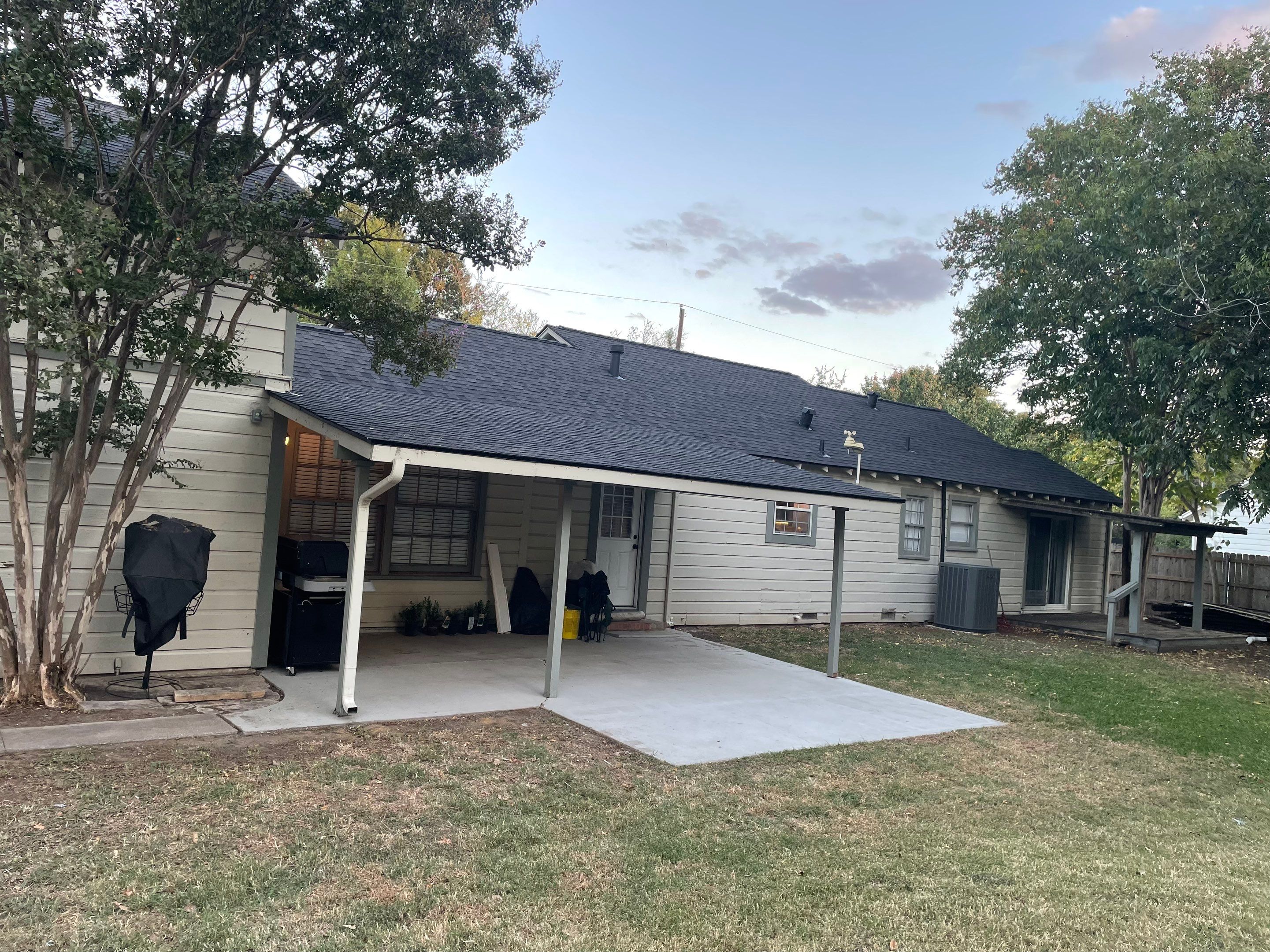 White exterior with IKO Glacier by Tejas Roofworks + Restoration