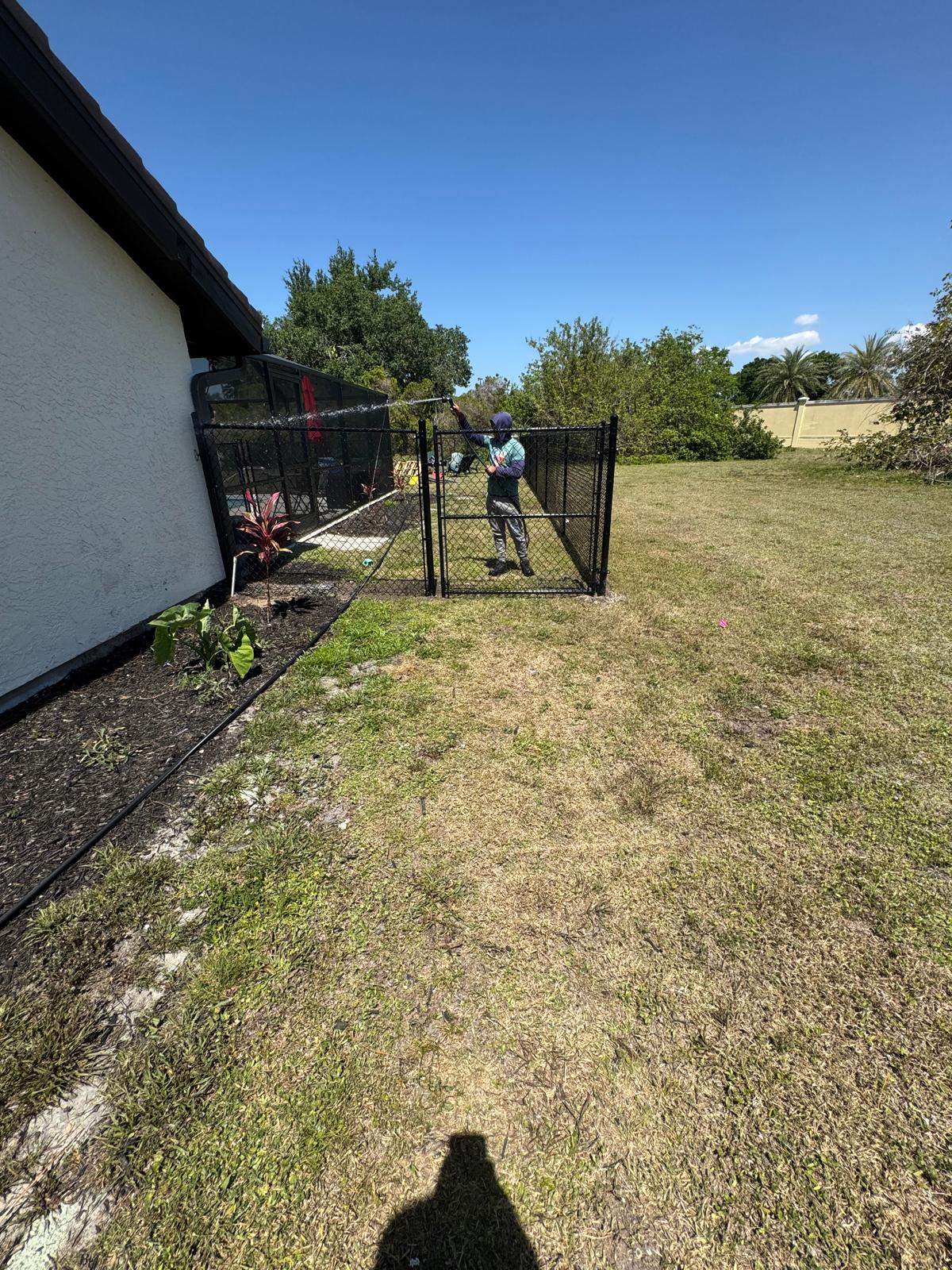 Black Chain Link Residential Backyard Fence Installation in North Port by True Fence LLC