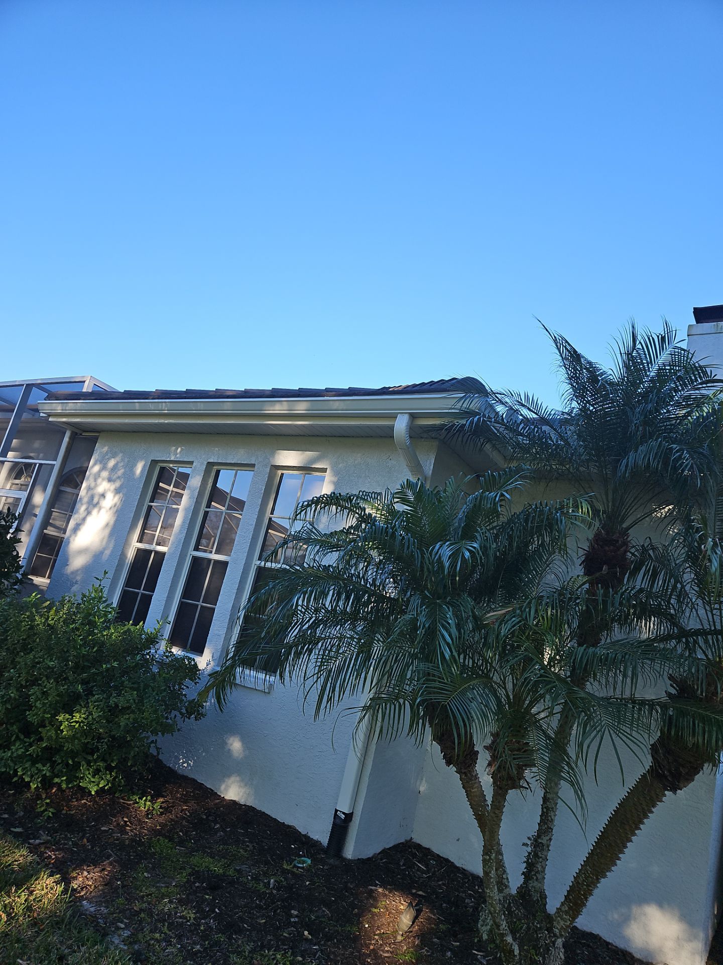 White Down Spouts using downspouts and White Seamless Gutters in Sarasota FL by Gutter Professors