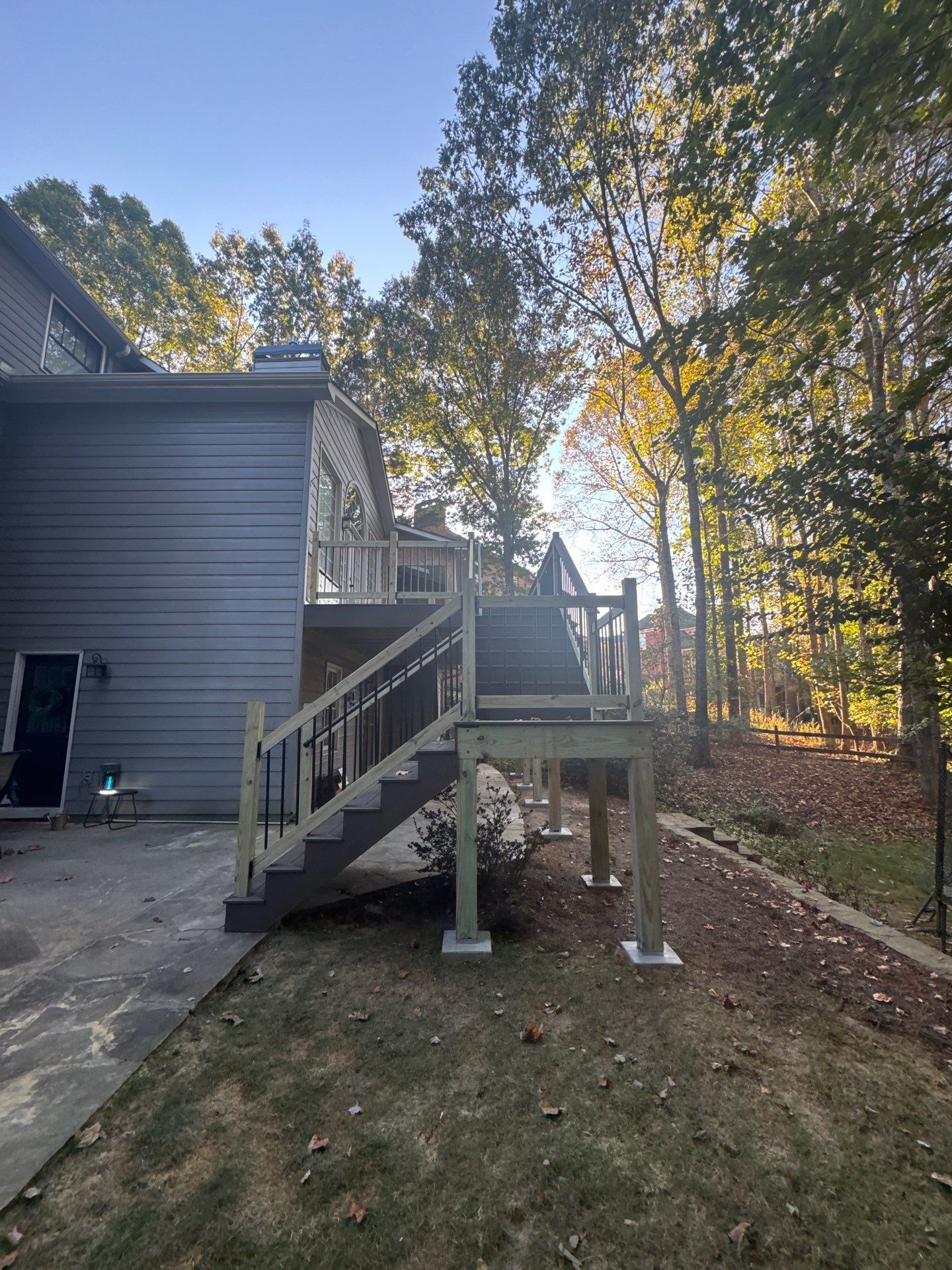 Custom Multi-Level Composite Deck and Sunroom Addition in Suwanee by Swift Home Renovations 