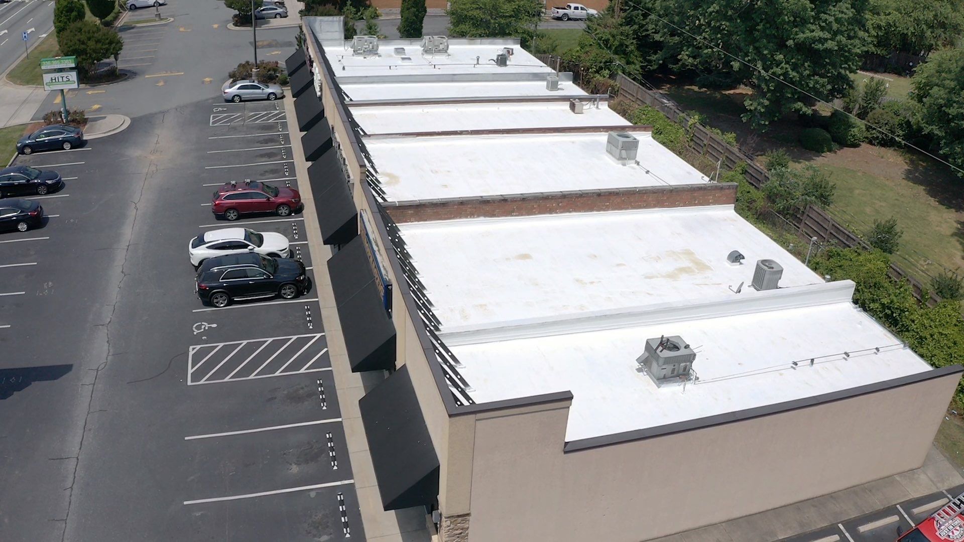 Commercial Roof Coating using Fiberseal basecoat and Silicon Topcoat by Just In Time Roofing and Restoration