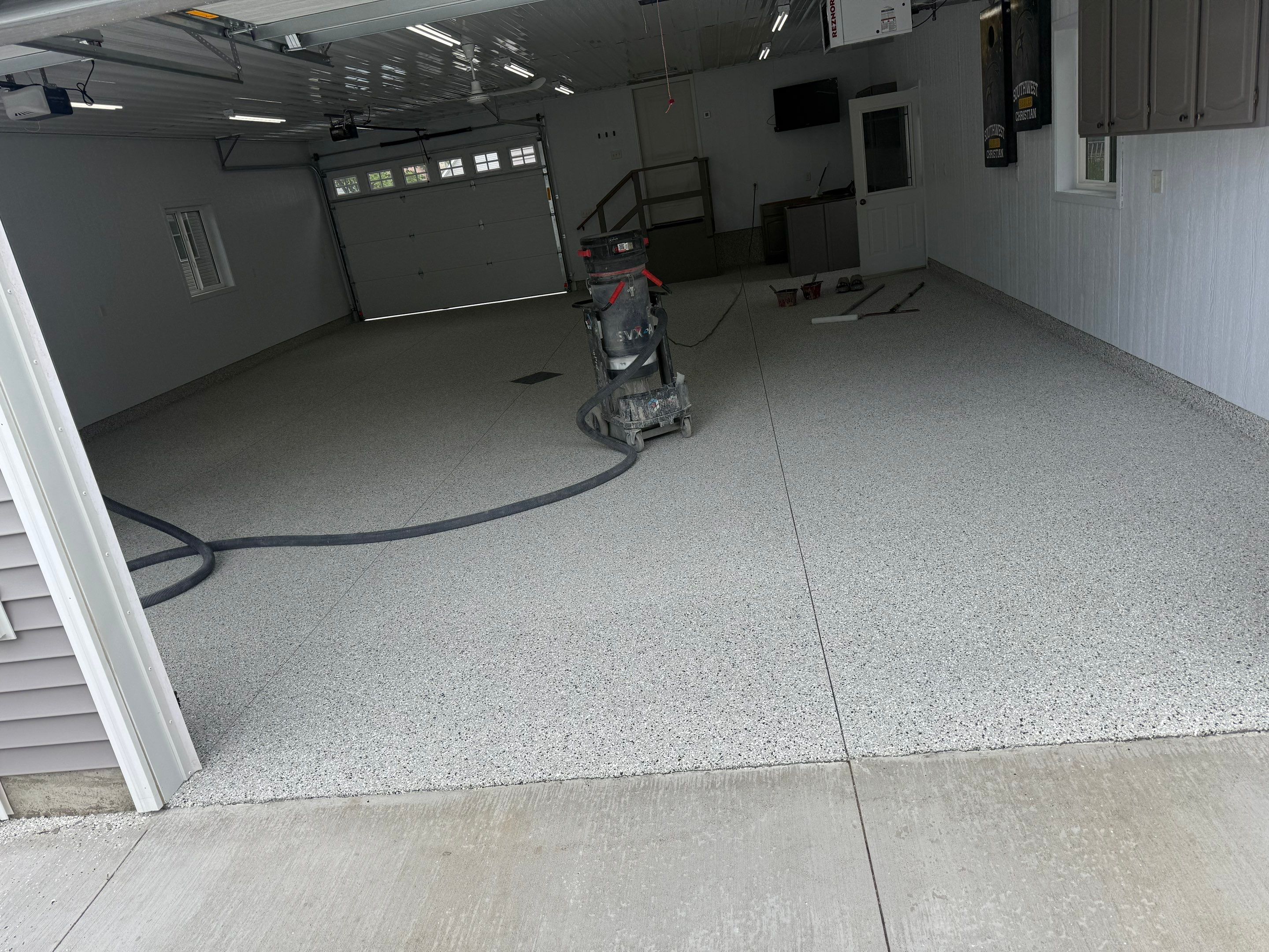 Speckled Epoxy Concrete Coating for Edgerton Garage Floor by Select Painting, Coatings & Garage Cabinets