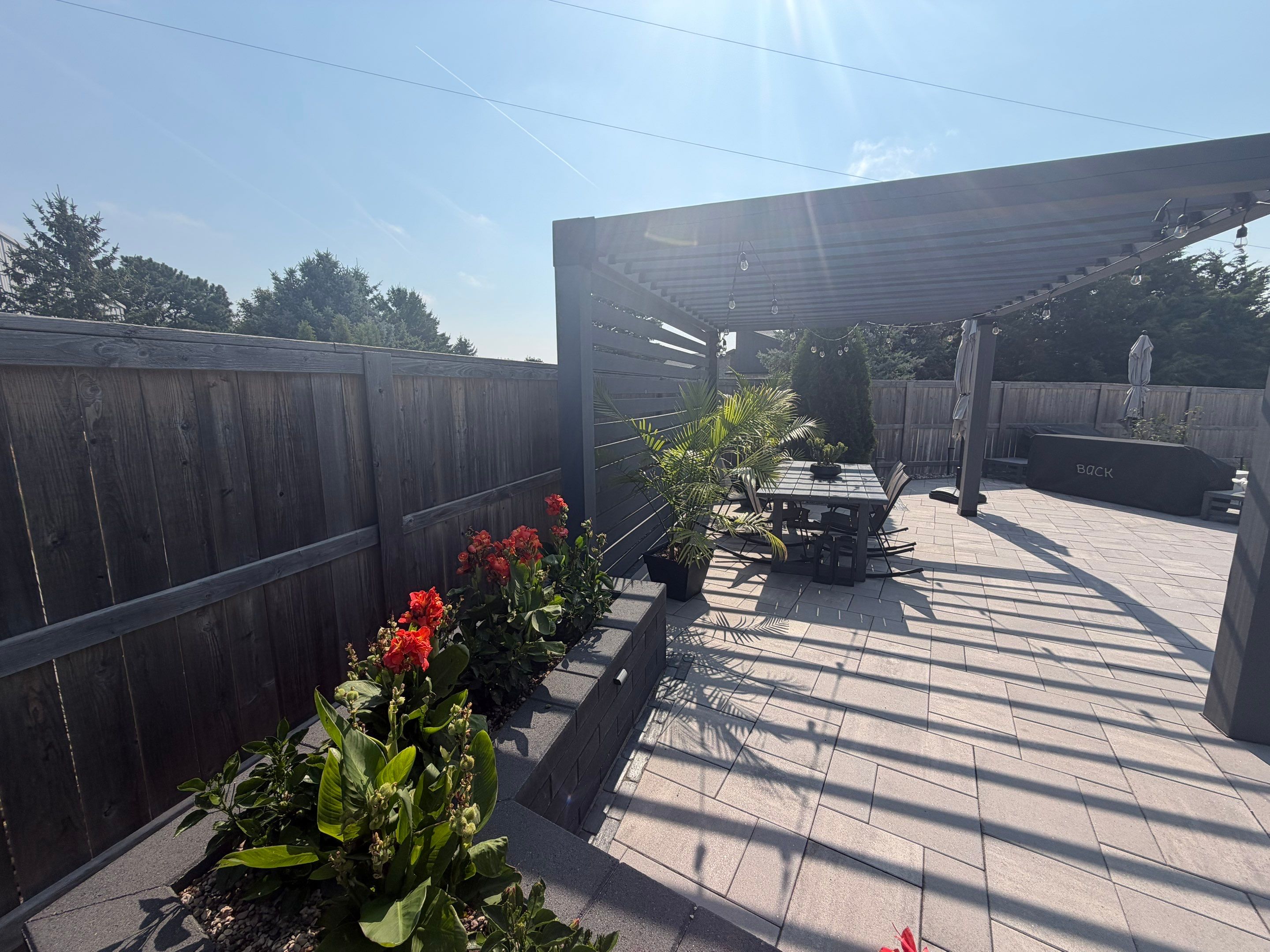 Custom Privacy Fence and Paver Patio Installation in Sioux Falls by Select Painting, Coatings & Garage Cabinets
