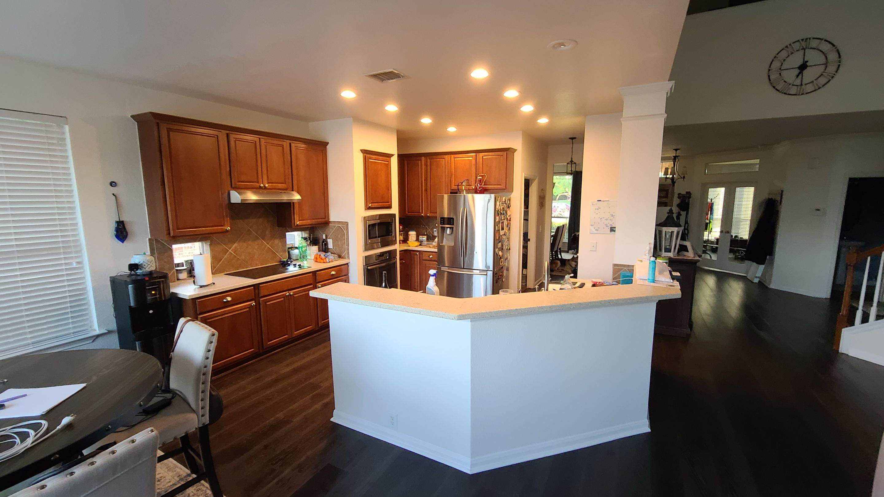 Stone Oak San Antonio Kitchen Remodel Featuring Custom White Cabinetry & Expanded Island by Legacy Bath and Kitchen 