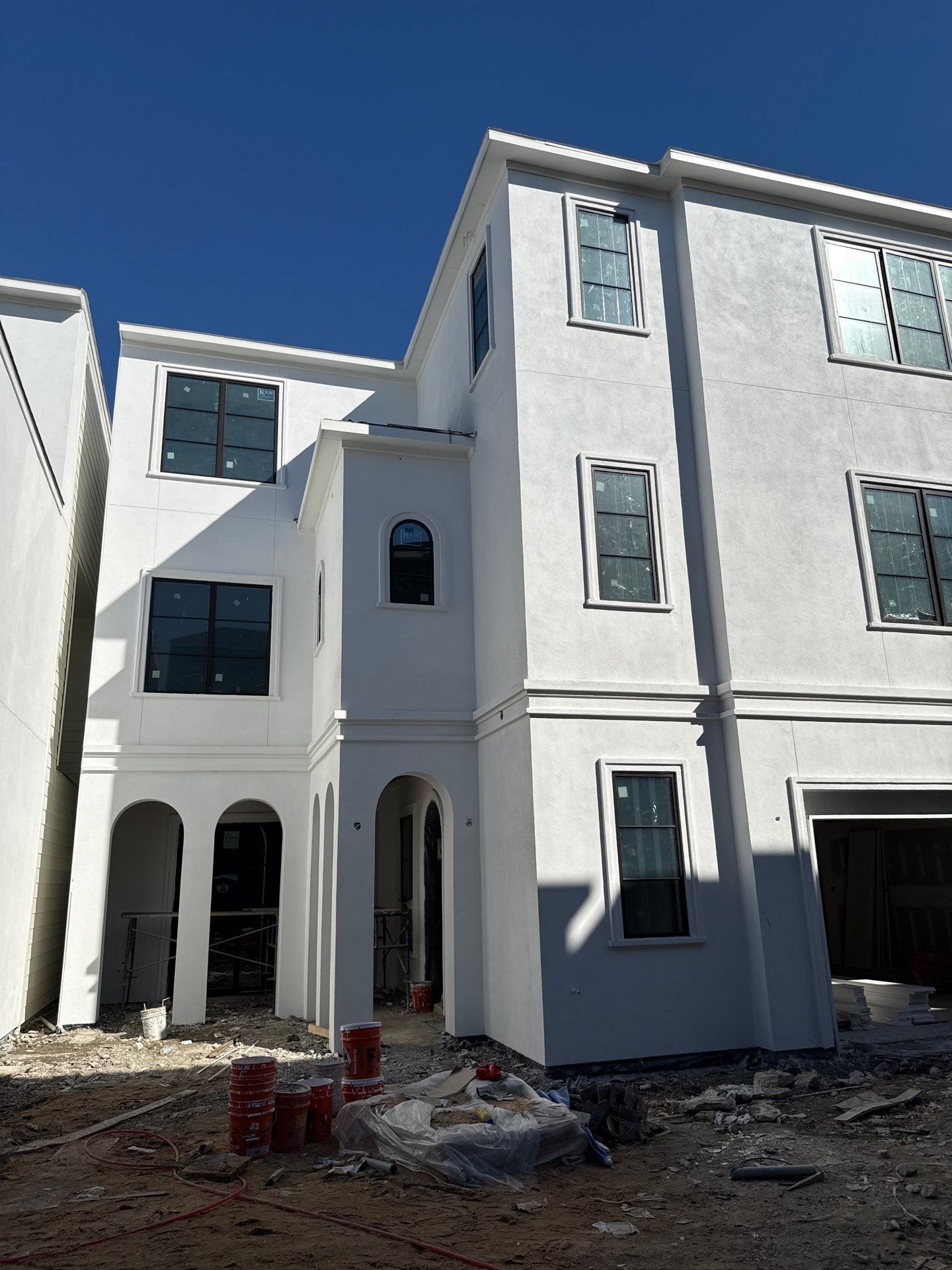 Modern Multi-Story Residential Stucco Home in Houston by Apex Conventional Stucco Llc