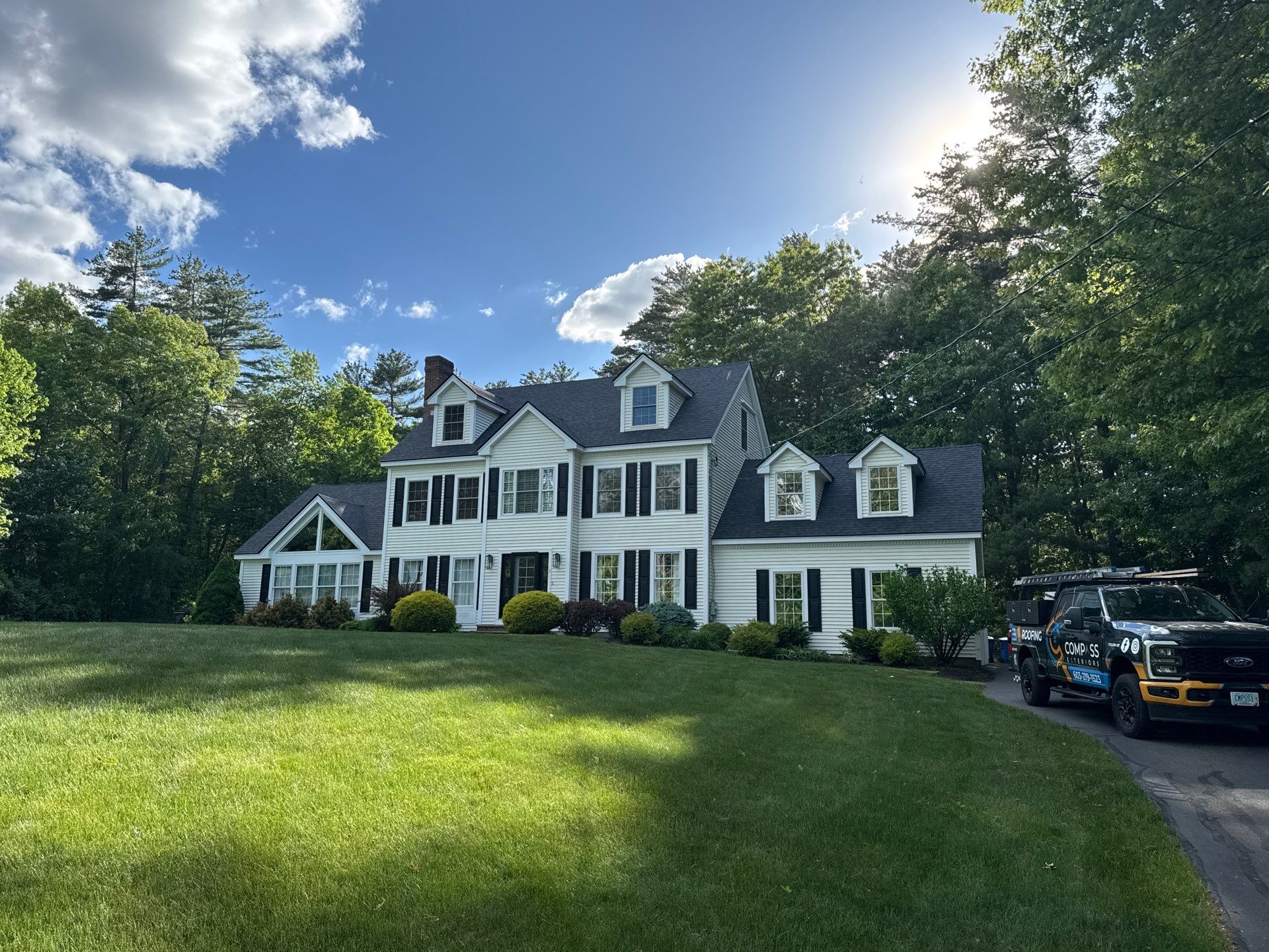 Roof Replacement on Cobbetts Pond in Windham, NH with Owens Corning Onyx Black Shingles by Compass exteriors