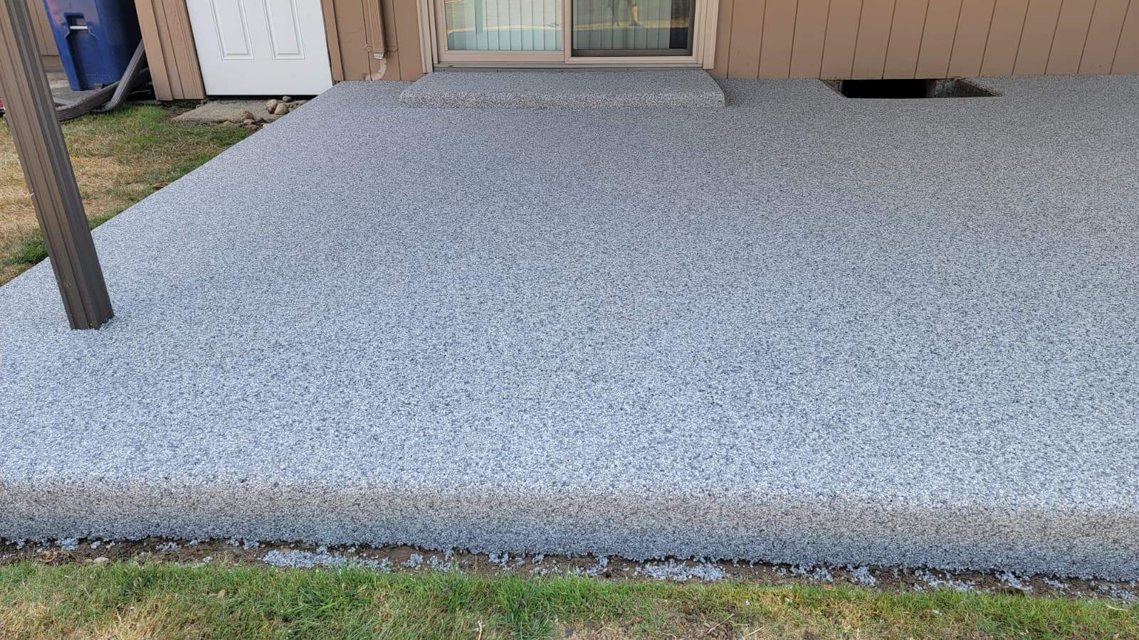 Coastal Elegance Patio in PoseidonVuba Stone by Concrete Coating Experts Inc.