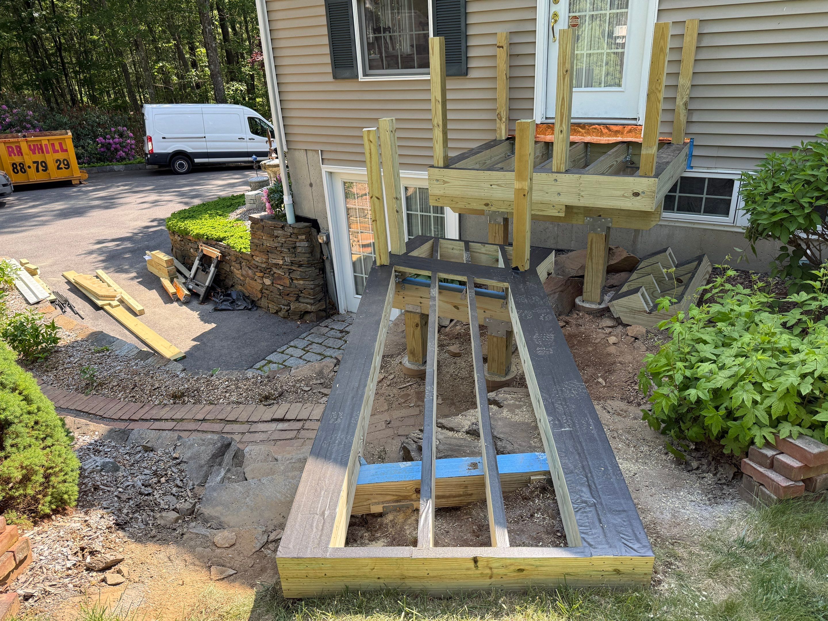Front Porch Replacement with Trex Lineage Biscayne and Trex Cocktail railing. by DiGiorgi Roofing and Siding Inc