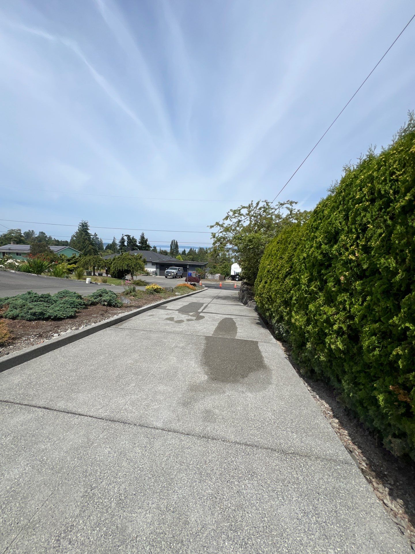 Concrete Driveway Makeover w/ Asphalt Patch | Everett  by Jireh Asphalt & Concrete Inc 