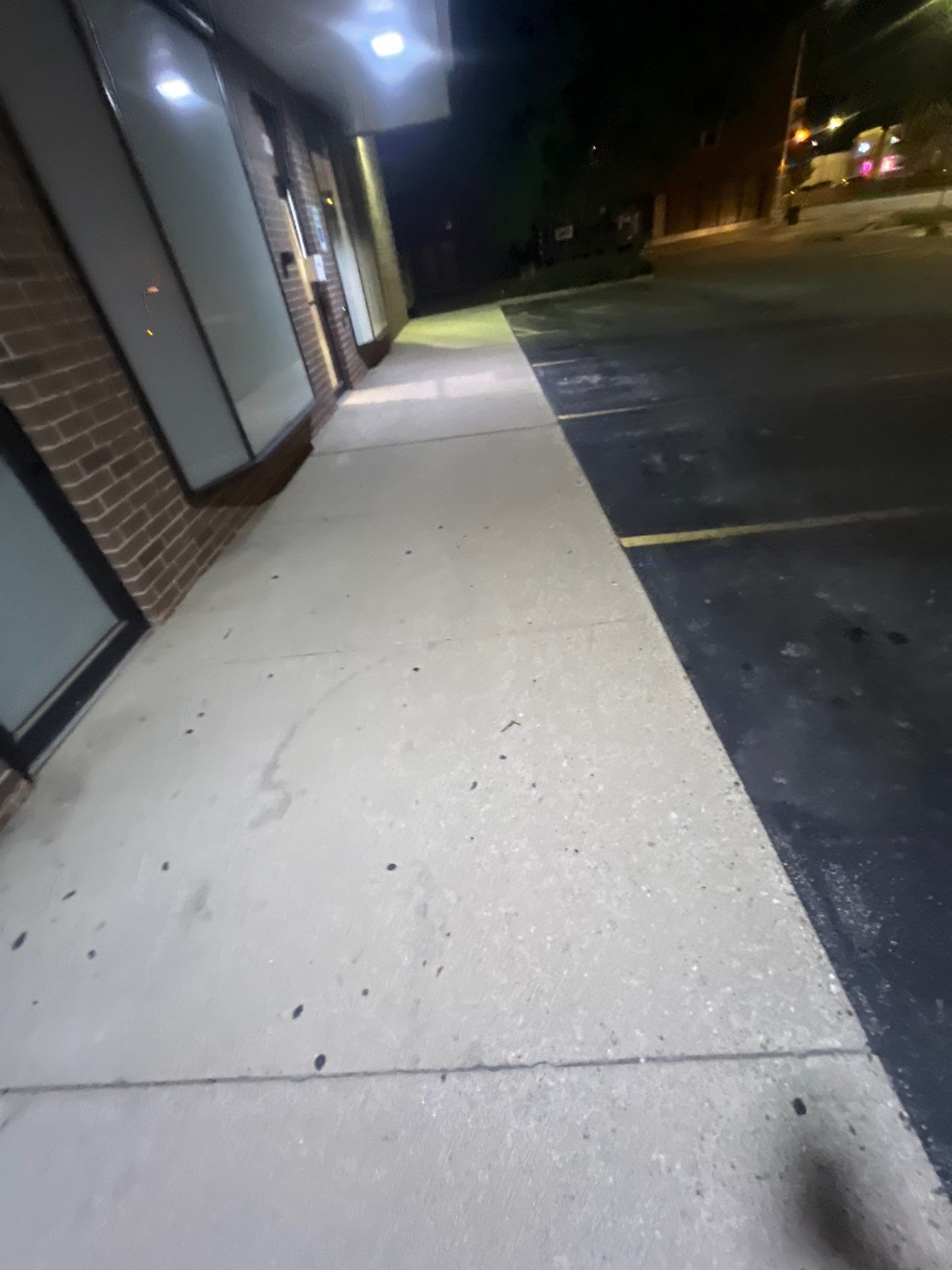 Commercial sidewalk cleaning. by Northern Power Washing LLC.