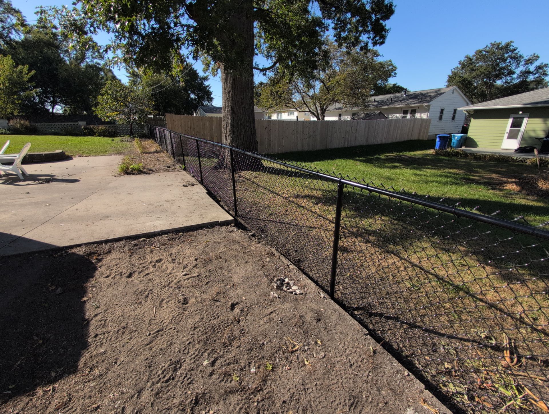 Black Chain Link Fence Installation for Waterloo Residential Property by Perfect Picket Fence and Stain