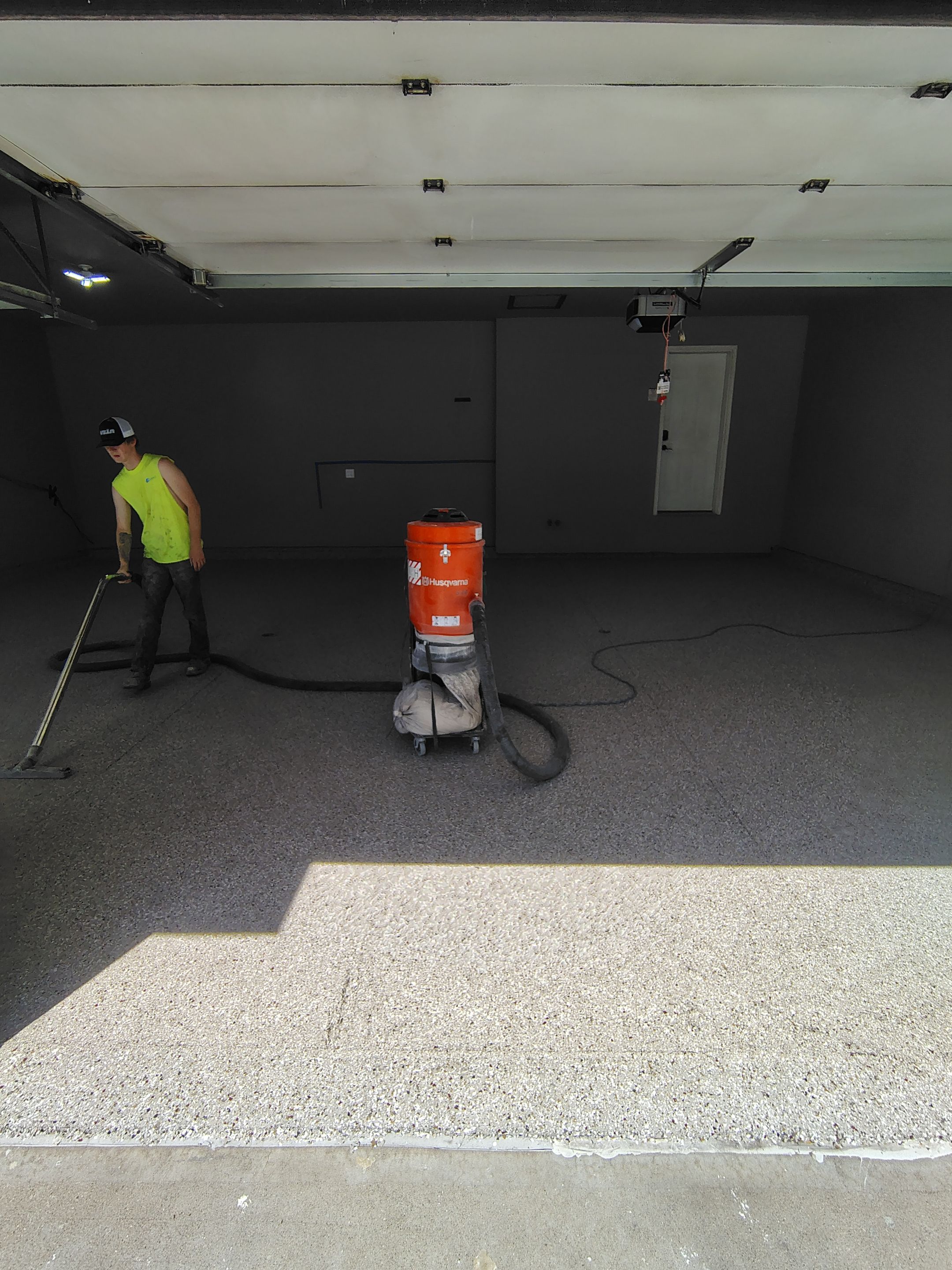Sioux Falls Garage Concrete Repair and Epoxy Flake Floor Coating by Select Painting, Coatings & Garage Cabinets