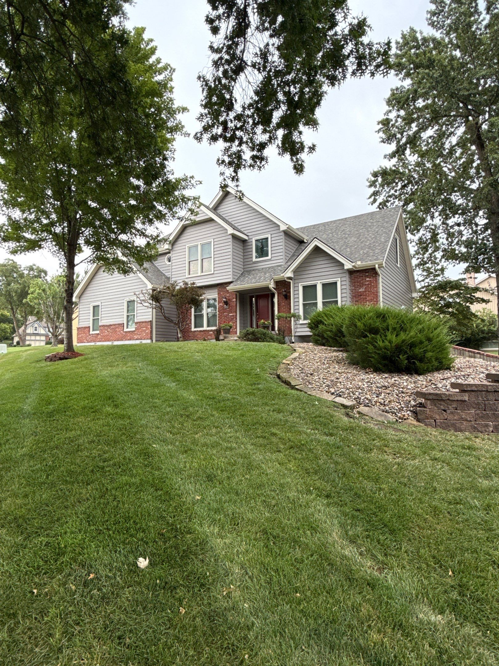 Whole Home Siding Replacement and Gutter Installation in Gladstone by EEC  Windows, Siding & Roofing 