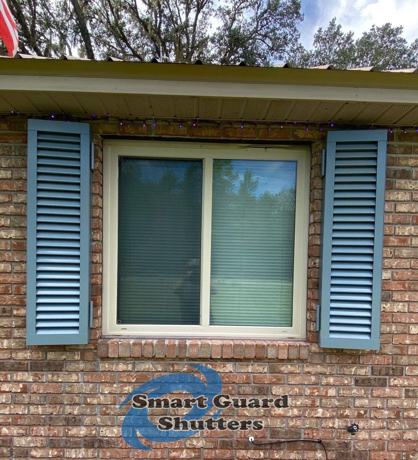 Impact Colonial Shutters in Squirrel Grey by Smart Guard Shutters