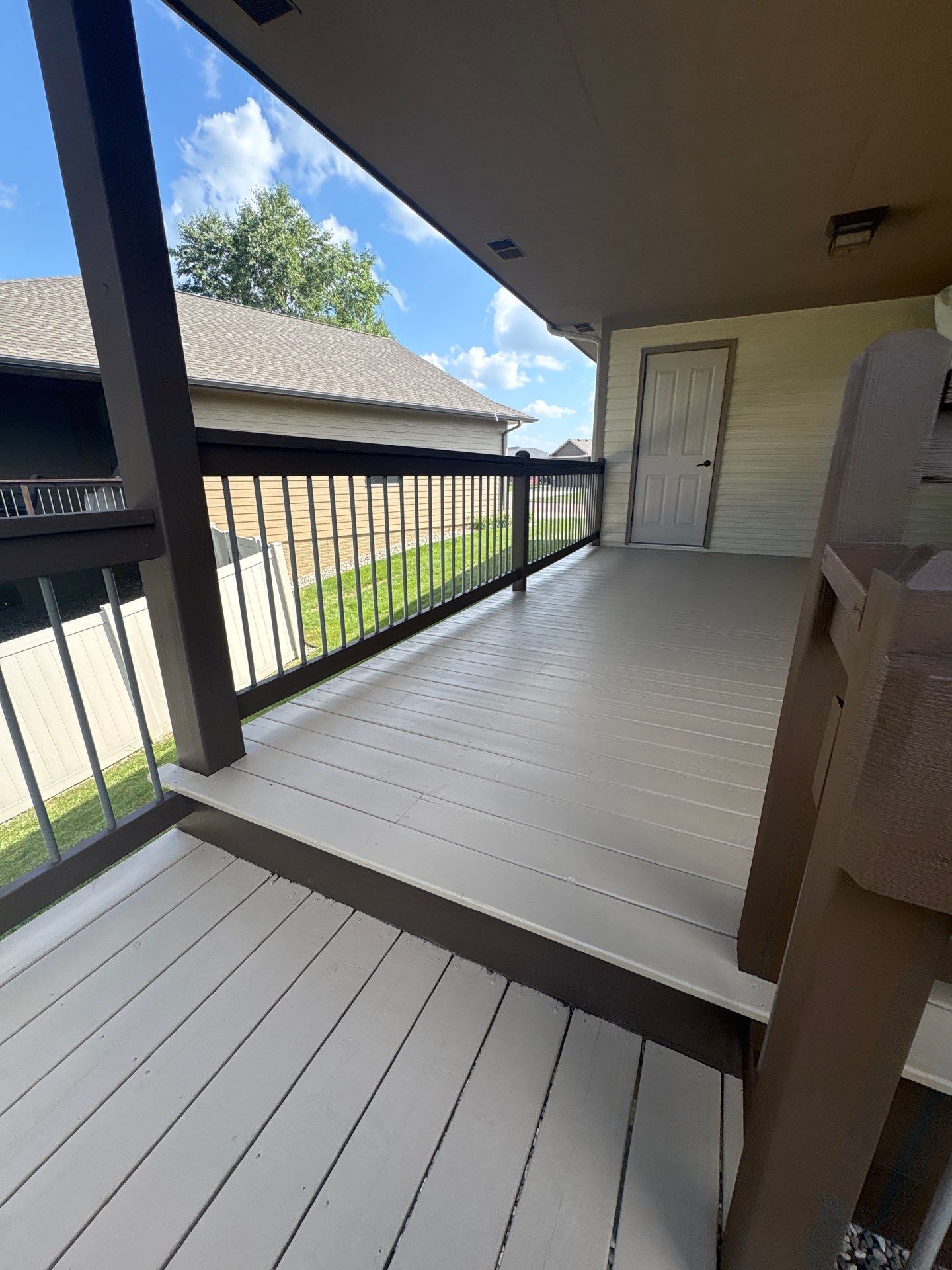 Sioux Falls Exterior Refresh and Multi-Level Deck Maintenance by Select Painting, Coatings & Garage Cabinets
