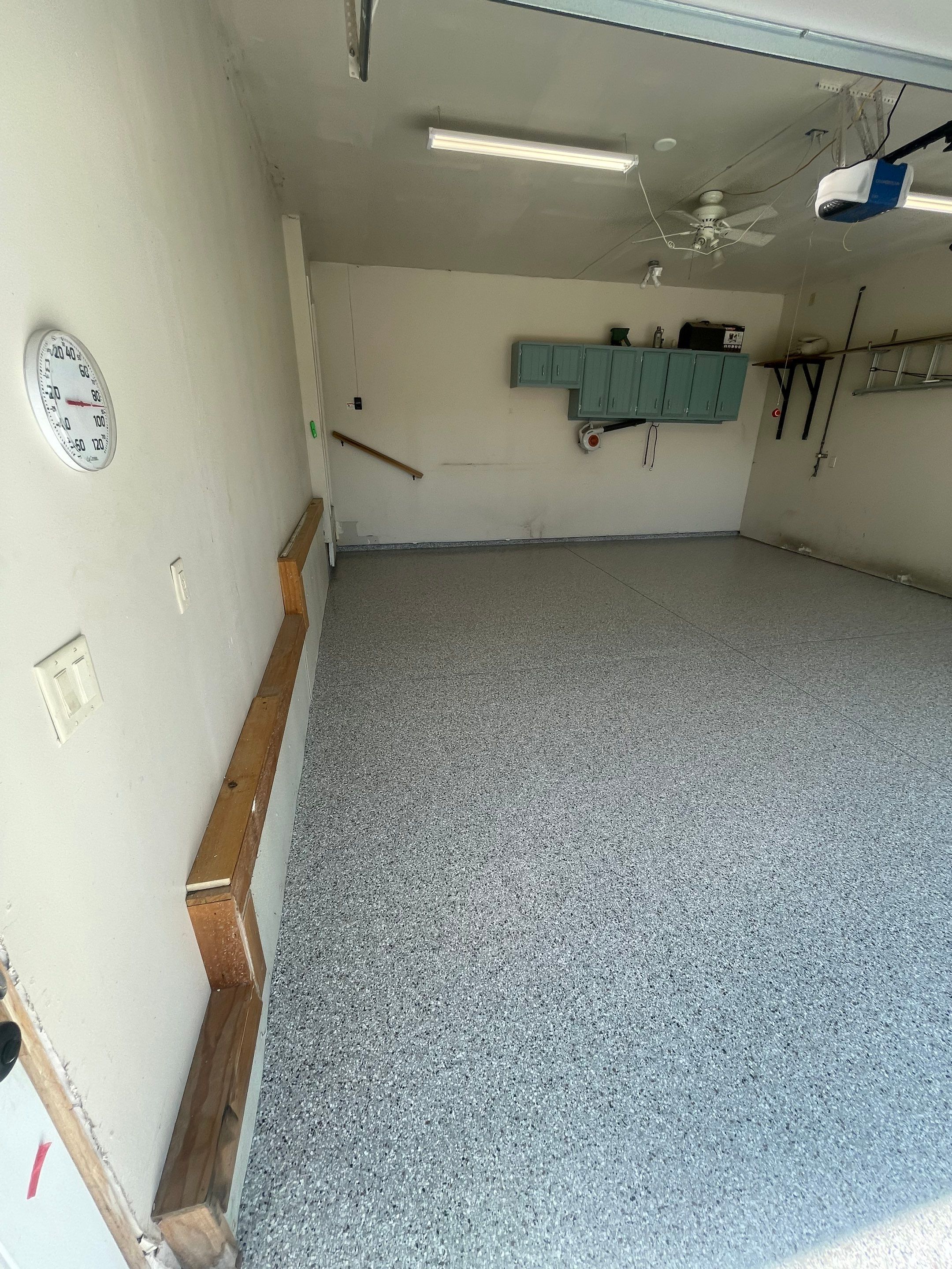 Multi-Stall Garage Floor Coating Installation in Sioux Falls by Select Painting, Coatings & Garage Cabinets