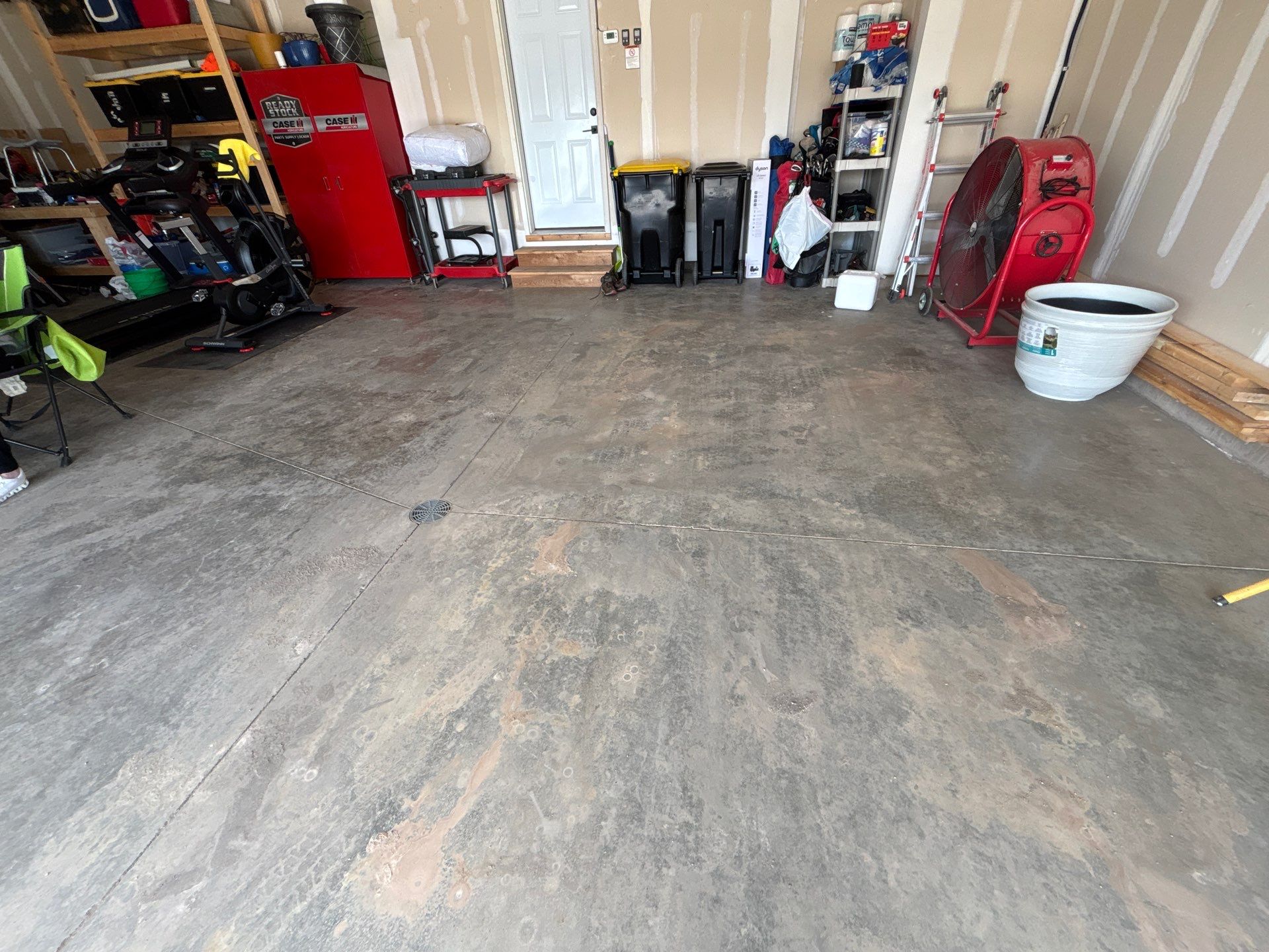 Grey Flake Epoxy Garage Floor Coating in Sioux Falls by Select Painting, Coatings & Garage Cabinets
