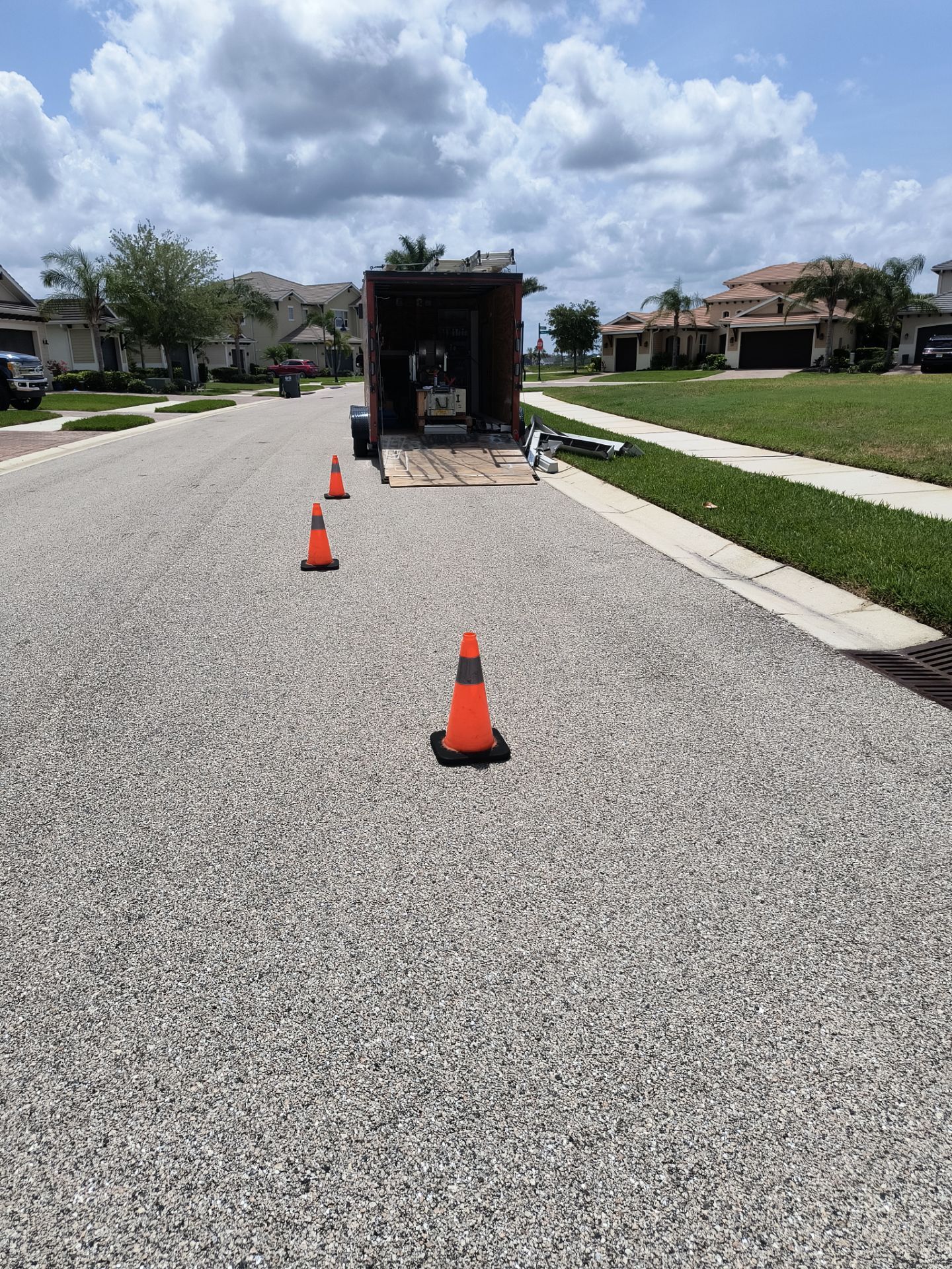 White Seamless Gutters with Downspouts in Bradenton FL by Gutter Professors
