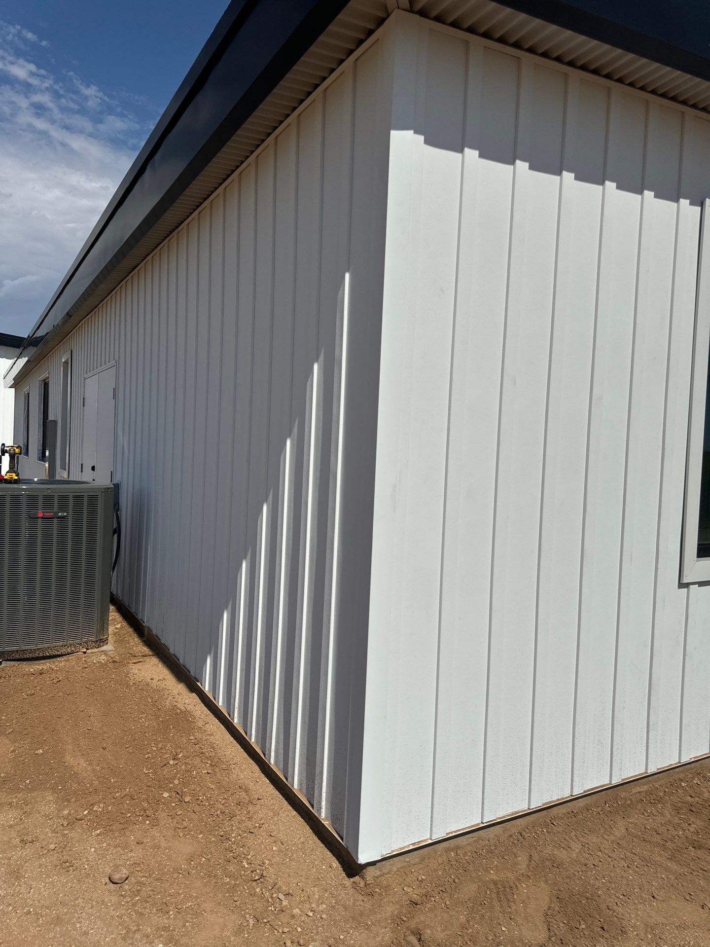 Polar White Metal Siding by Reimagine Roofing