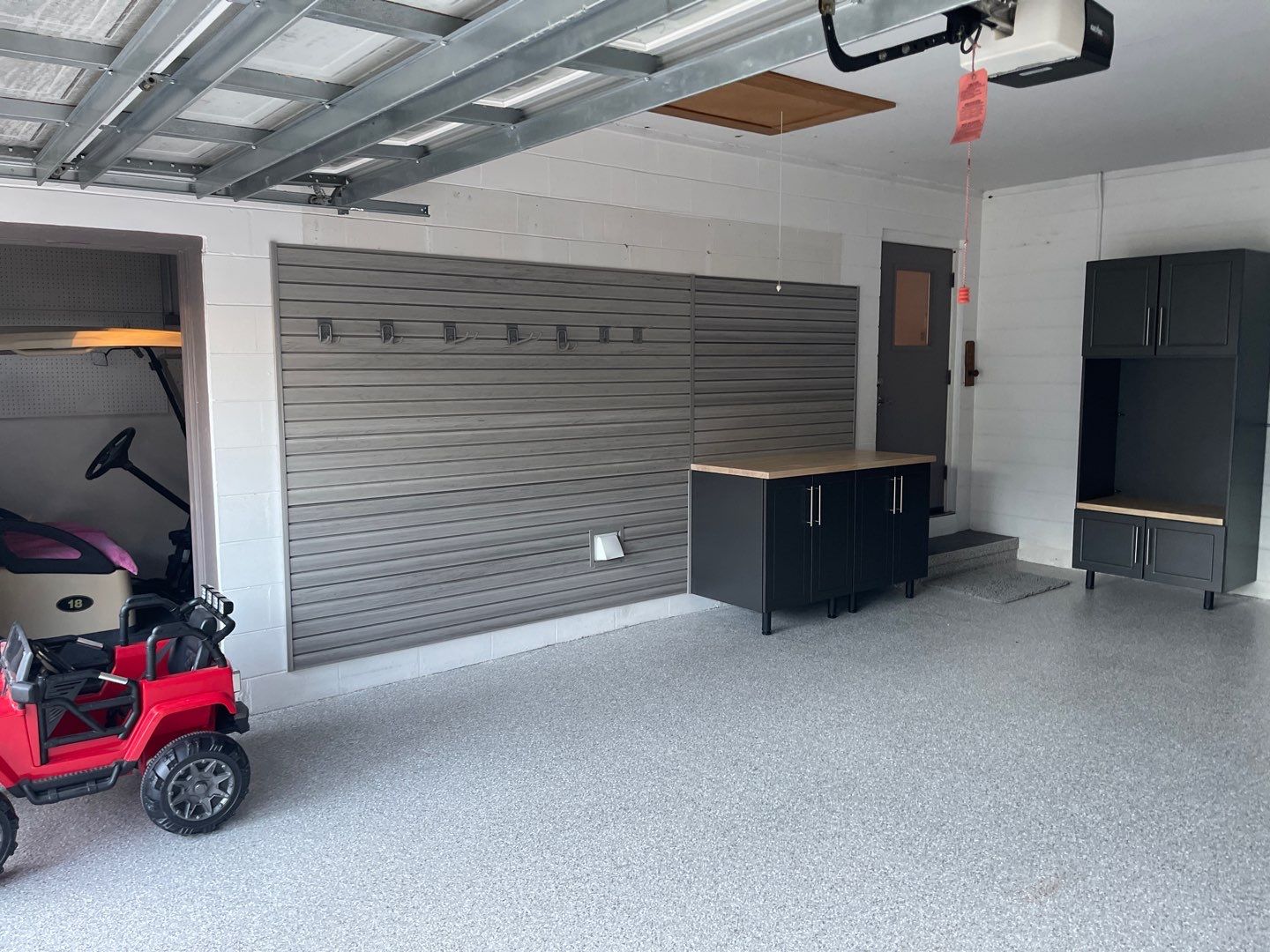 Garage with Cabinets in Gainesville, FL in Mount Everest by Cross Creek Concrete Coatings