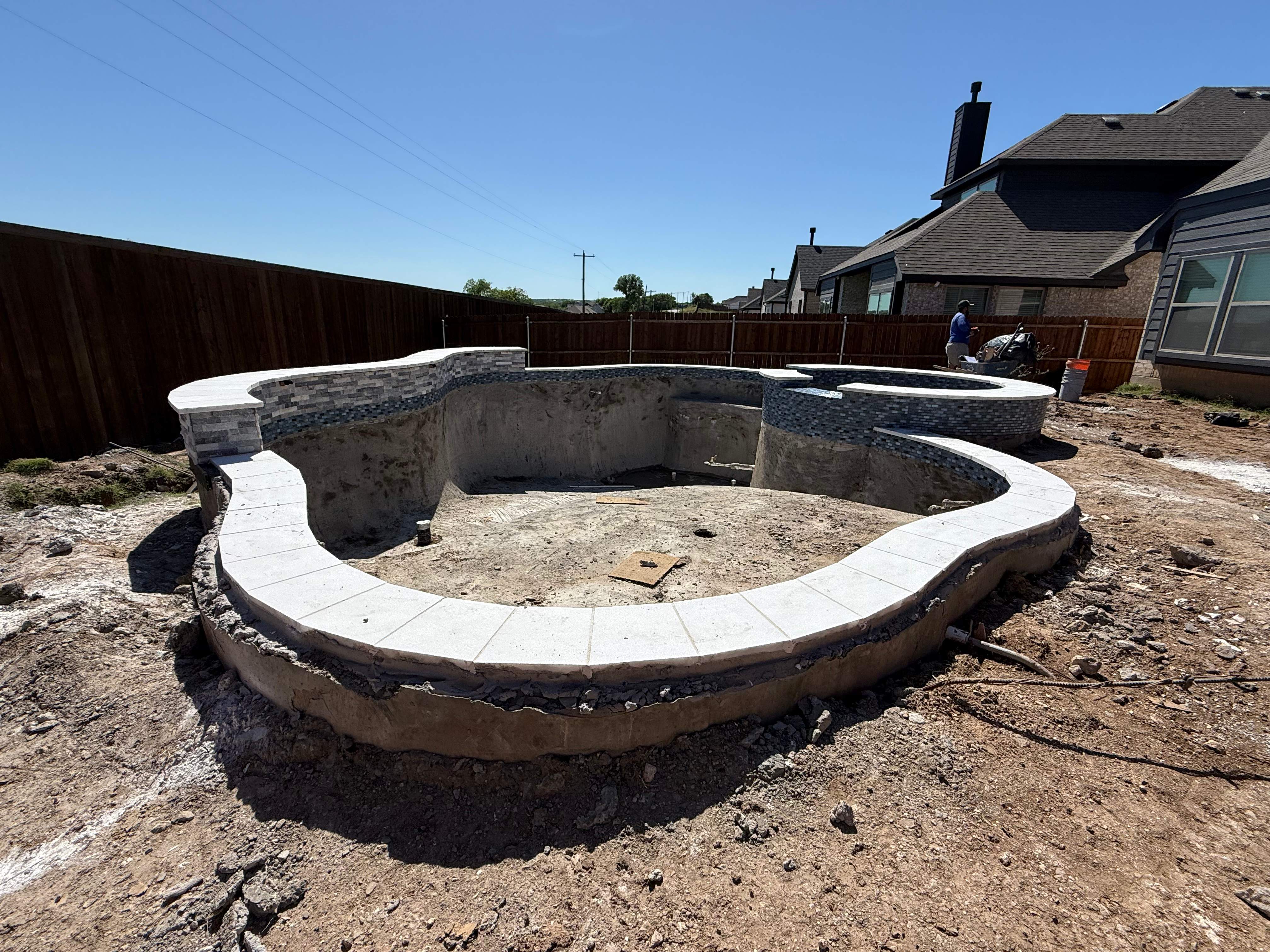 Freeform Pool with Raised Stone Spa by Pinnacle Pools and Spas - DFW