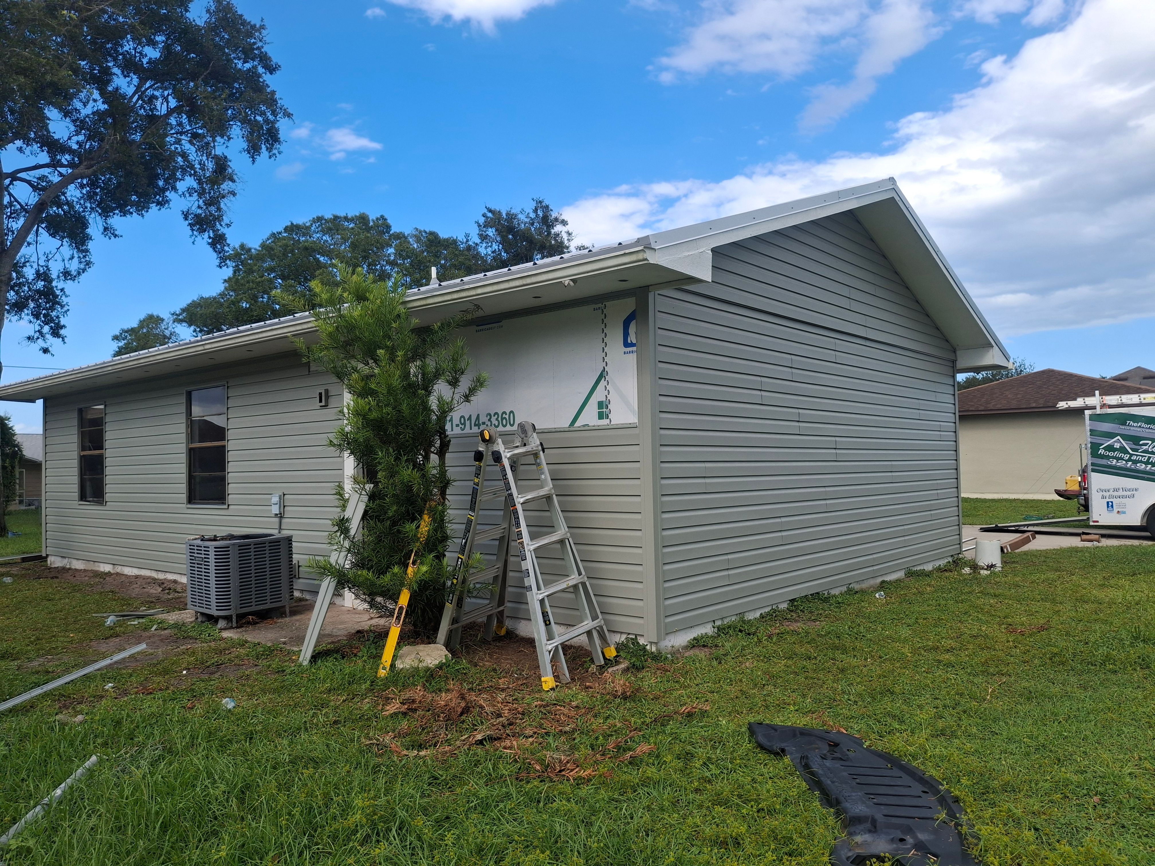 Vinyl Siding Installation and Structural Wood Rot Repair in Palm Bay by Florida Roofing and Renovations Inc.