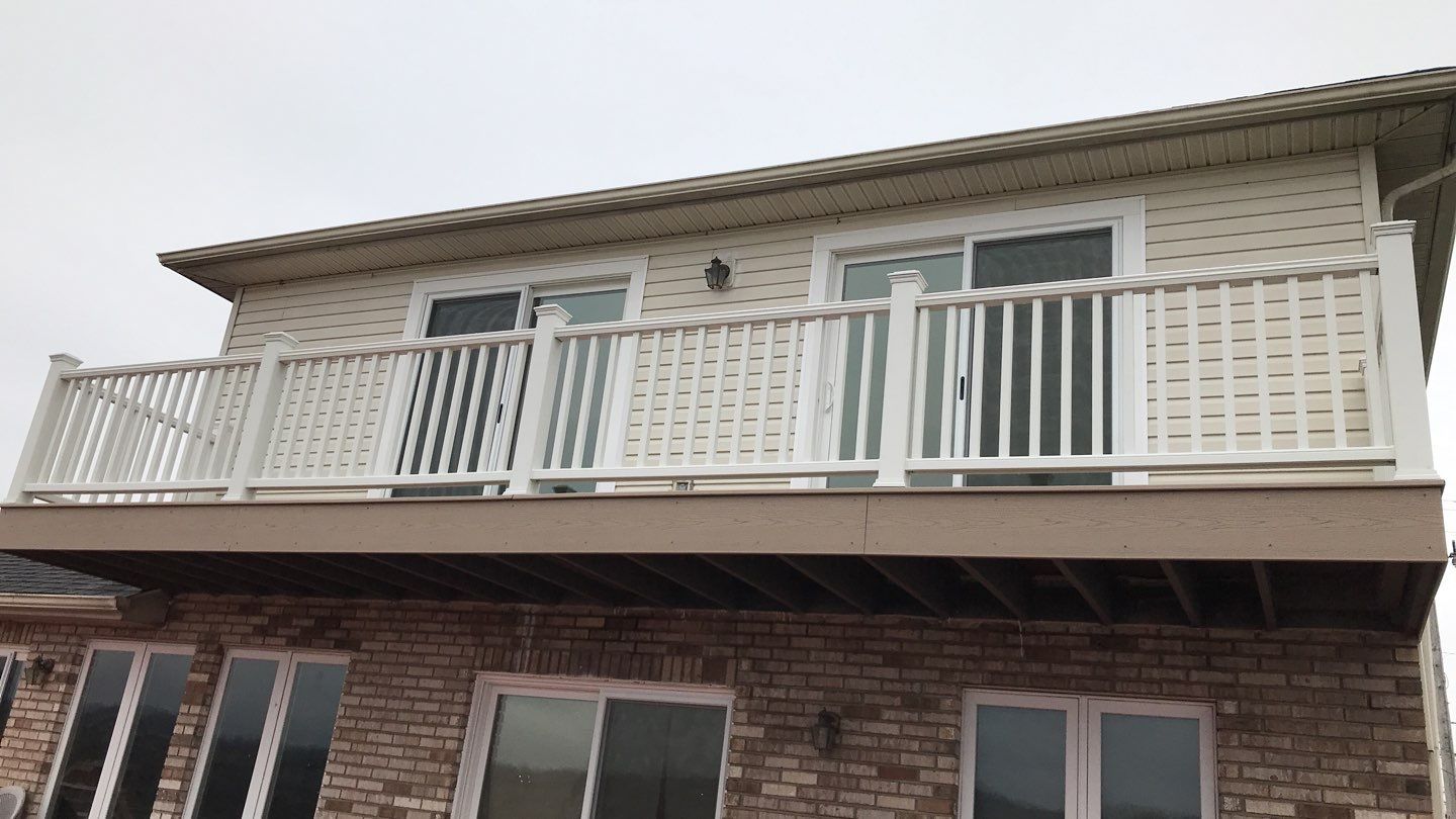 Deck Refurbush and Door Replacement using Trex Decking and Railing. Polaris Patio Doors by Secure Construction Company Inc
