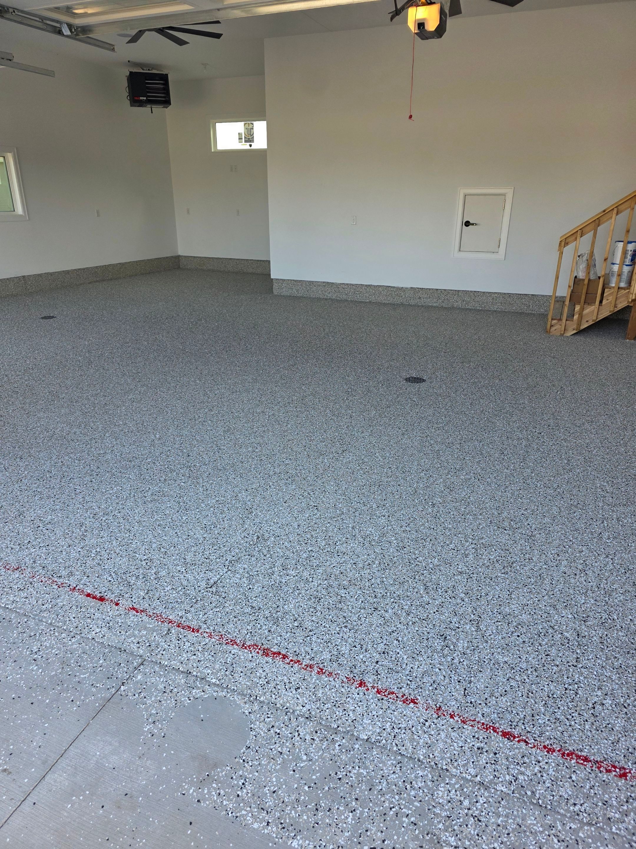 Gray and Black Speckled Polyurea Garage Floor in Dell Rapids by Select Painting, Coatings & Garage Cabinets