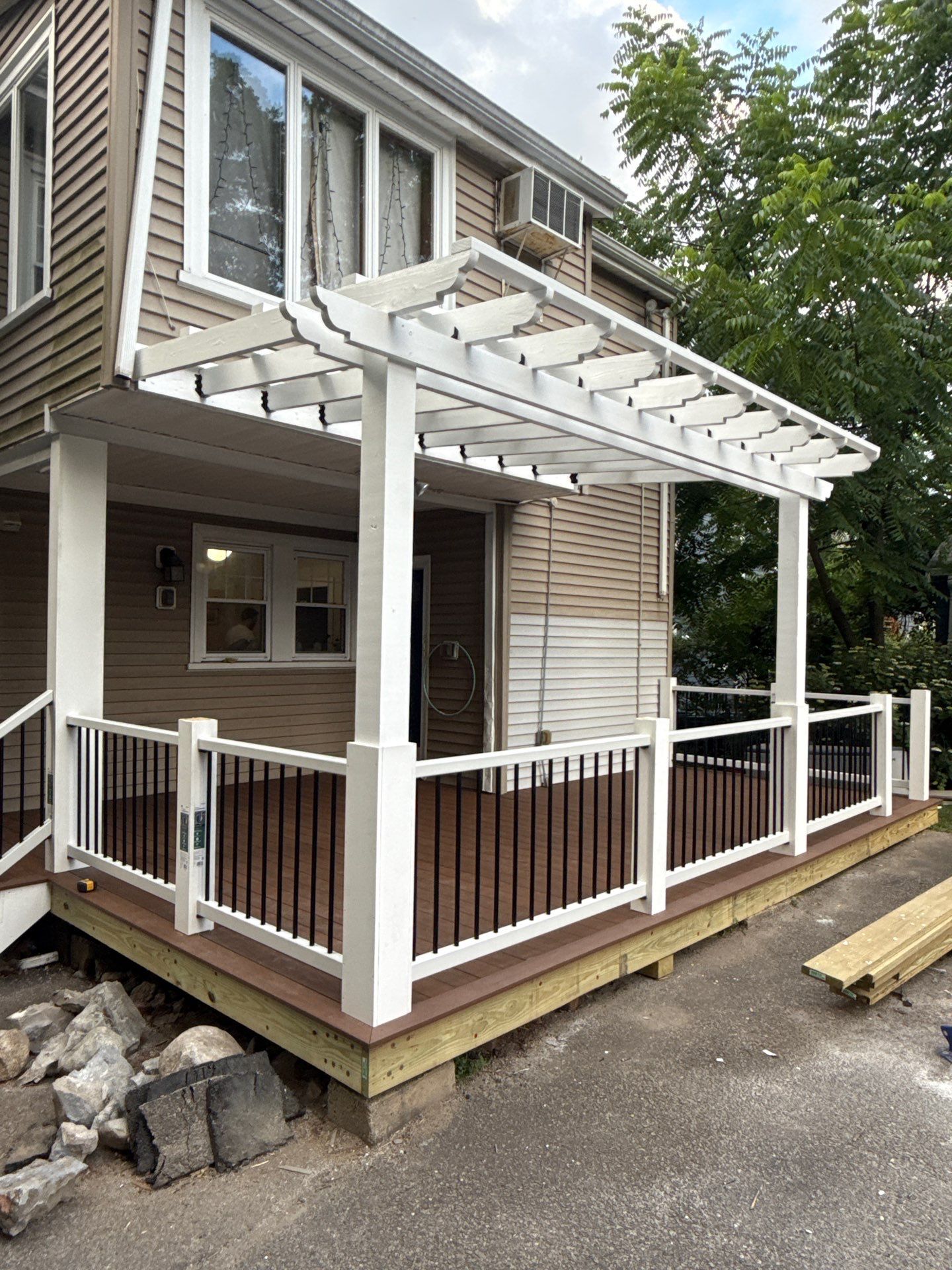 new deck with custom pergola by CabralCarpentry & Painting LLC