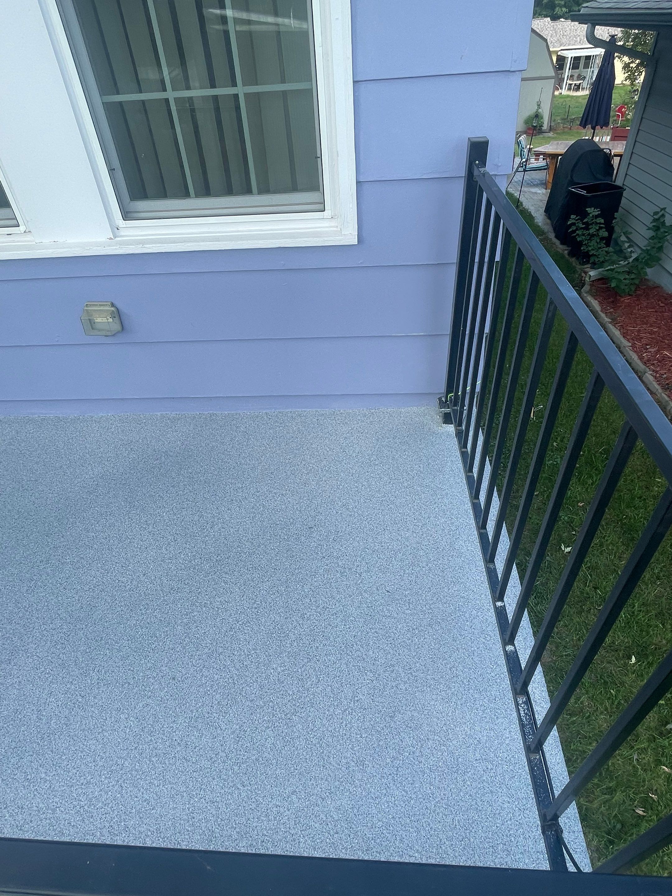 Sioux Falls Concrete Porch Coating with Starry Evening Finish by Select Painting, Coatings & Garage Cabinets