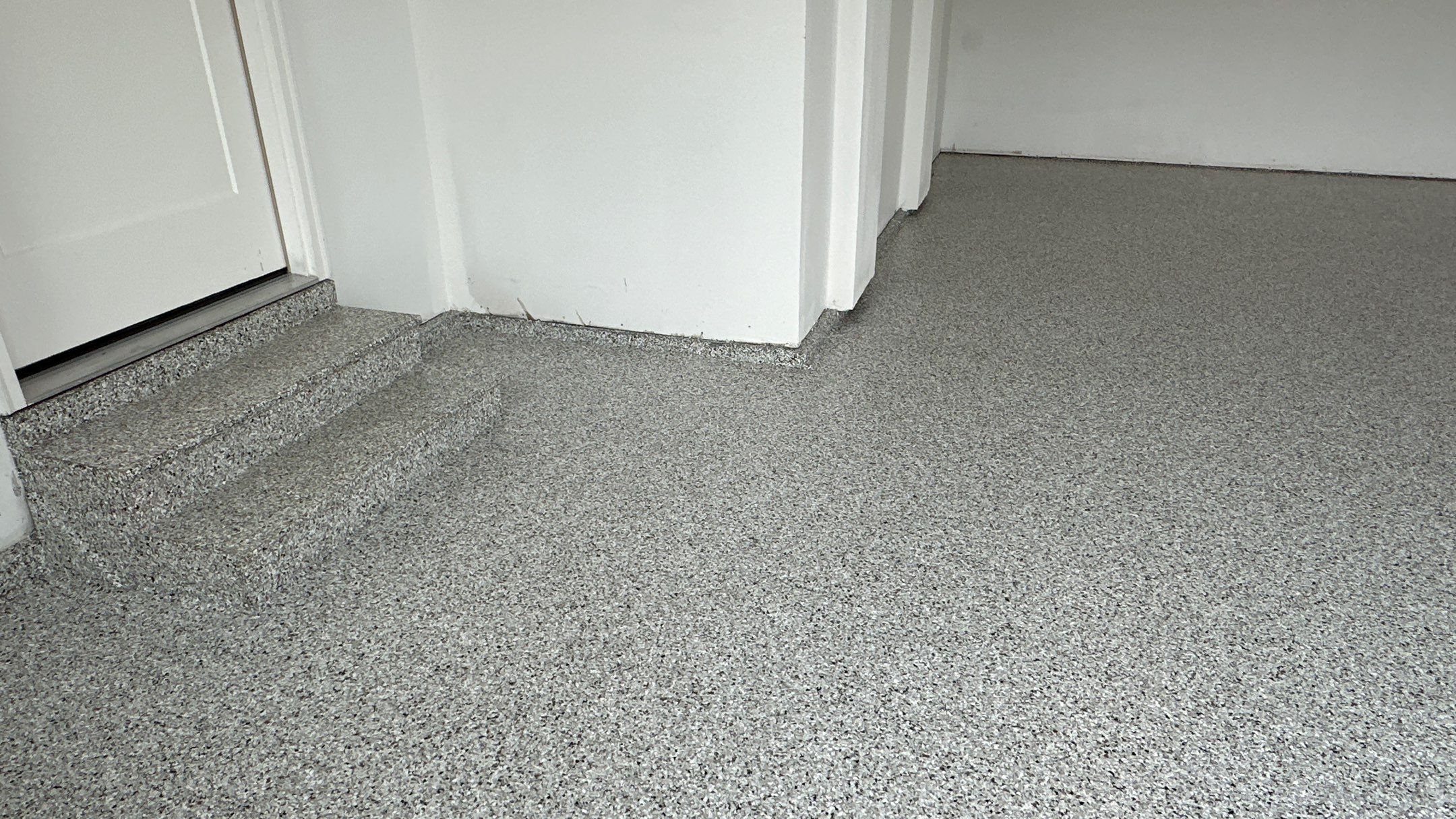Jon S. transformed his garage with a new floor, slotwall & Cabinets! by Banner Garage