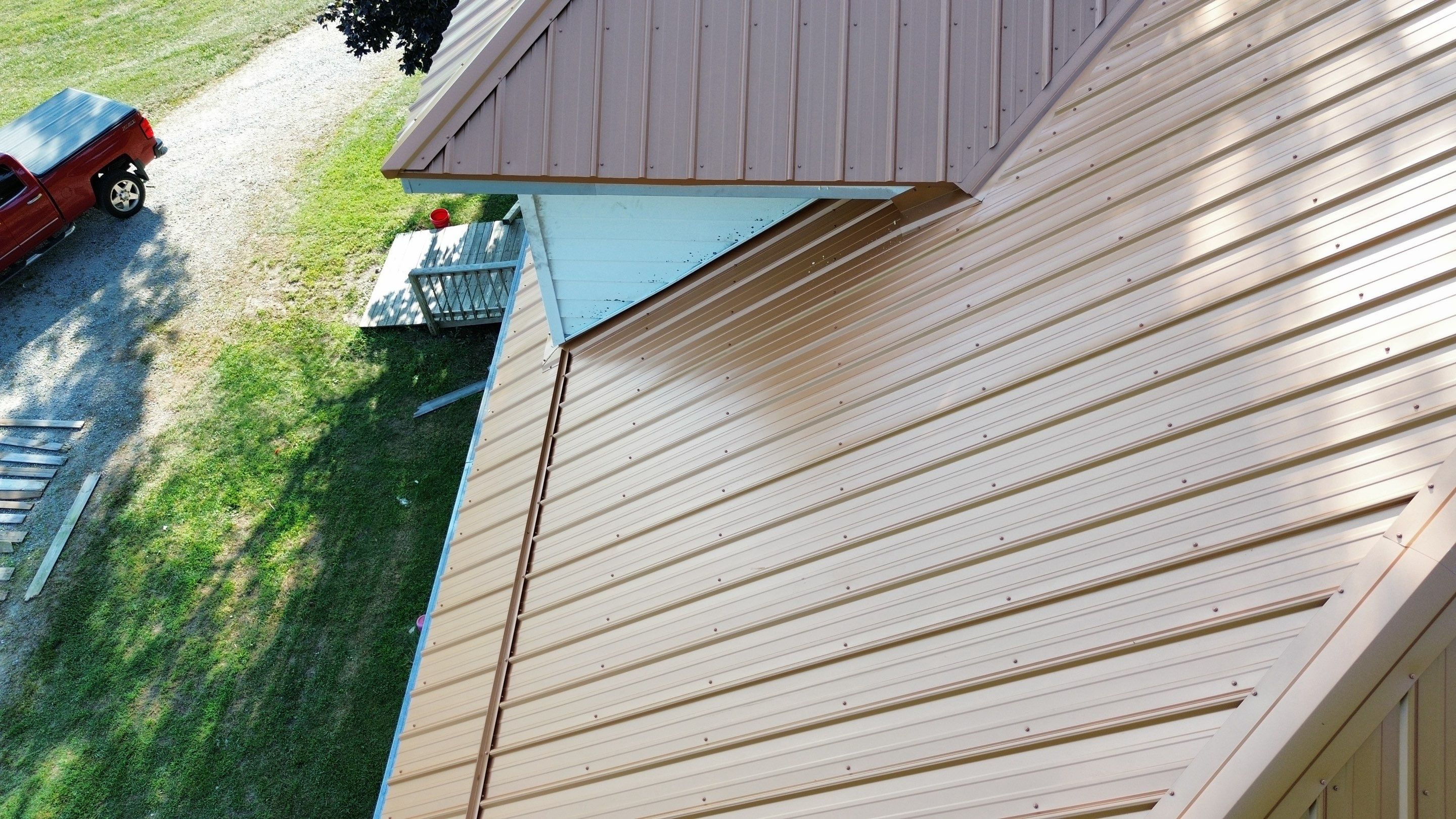 Residential Roofing Installation using Performance Panel Metal - Copper Metallic by RoofX 