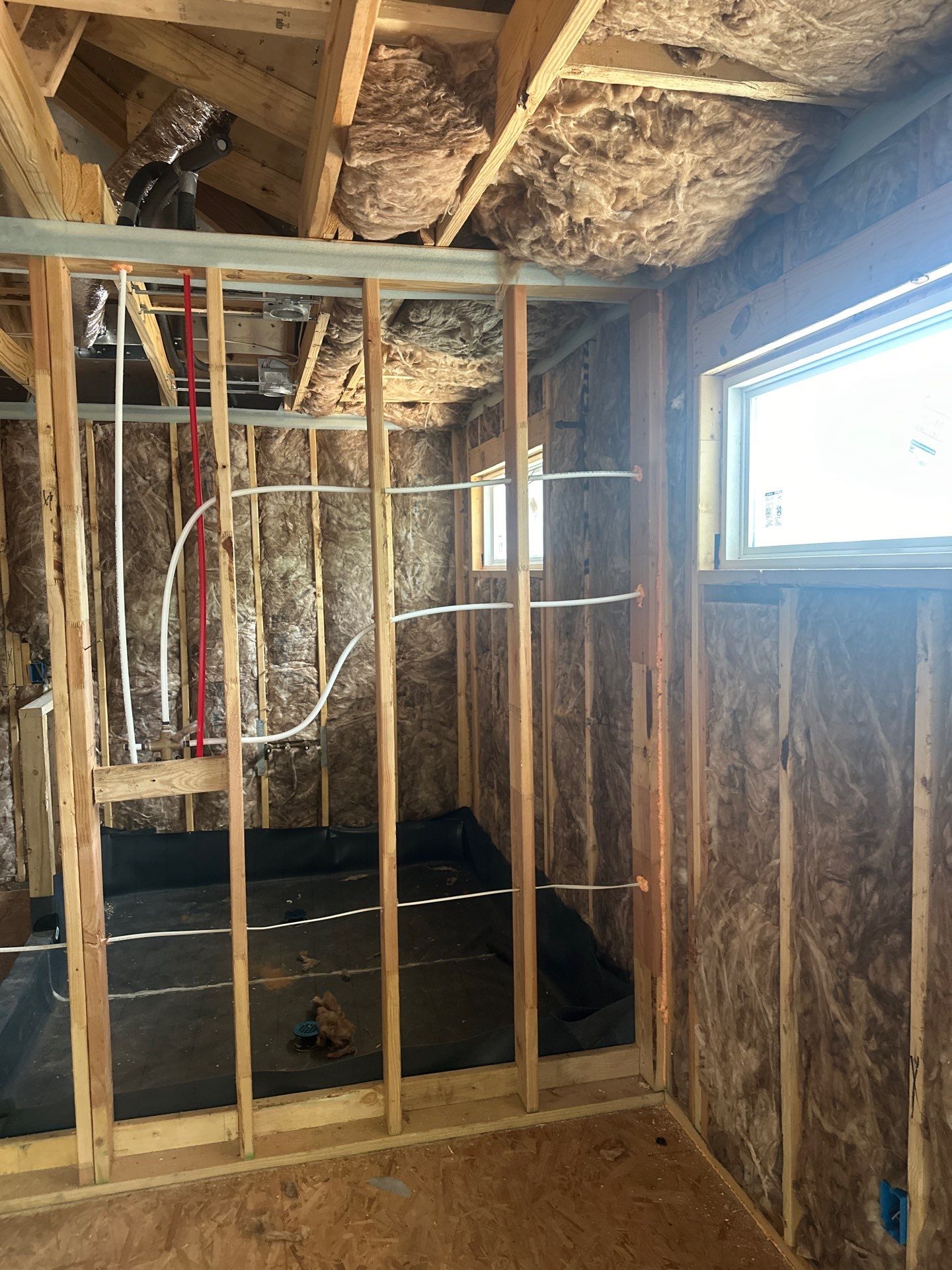 Fiberglass batt install on a second story addition in Dallas by Apex Insulation Solutions